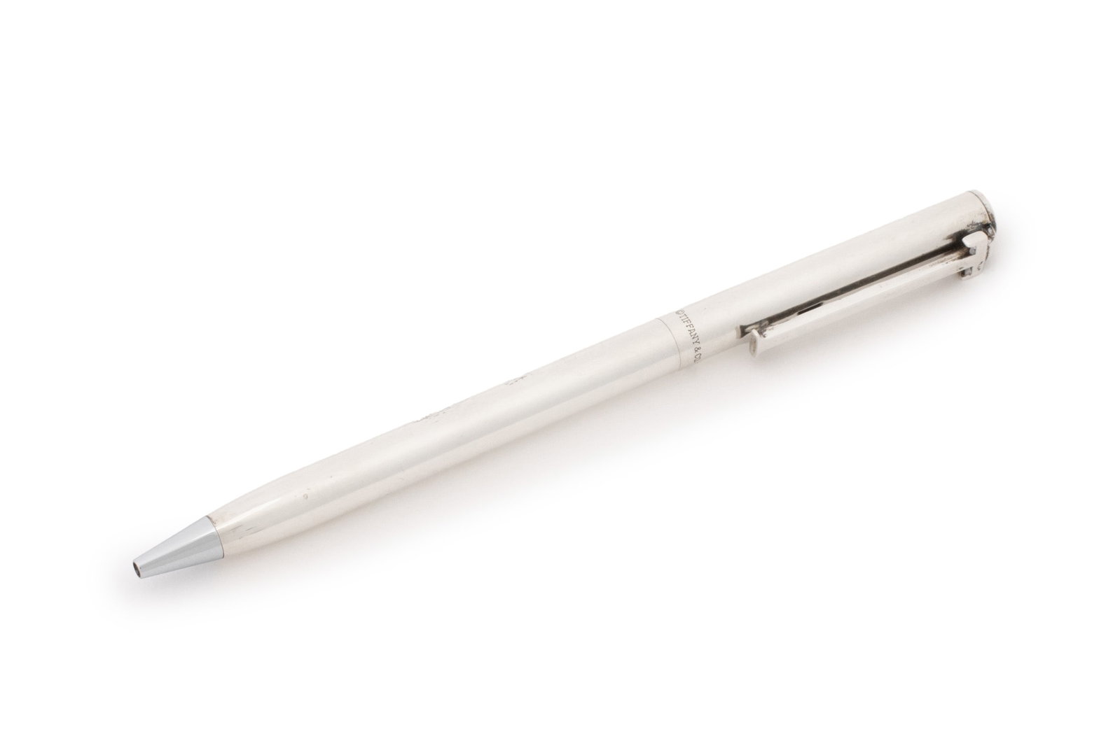 Tiffany & Co. Sterling Silver T-Clip Ballpoint Pen: Tiffany and Company Sterling Silver T-Clip Ballpoint Pen, with "WB" logo to end, marked "Tiffany & Co. Sterling", together with dust bag. 5" L. Provenance: From an Upper East Side Estate. Keywords: Wa