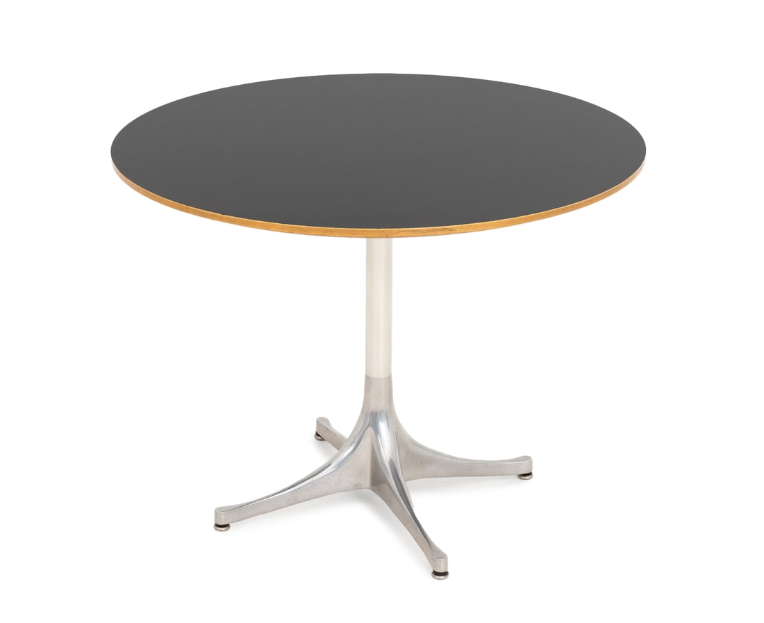 George Nelson for Herman Miller Pedestal Table: George Nelson for Herman Miller Pedestal Table, black veneered maple top above aluminum base, partial Herman Miller label to underside. 21.75" H x 28.5" Diameter. Provenance: An East 87th Street
