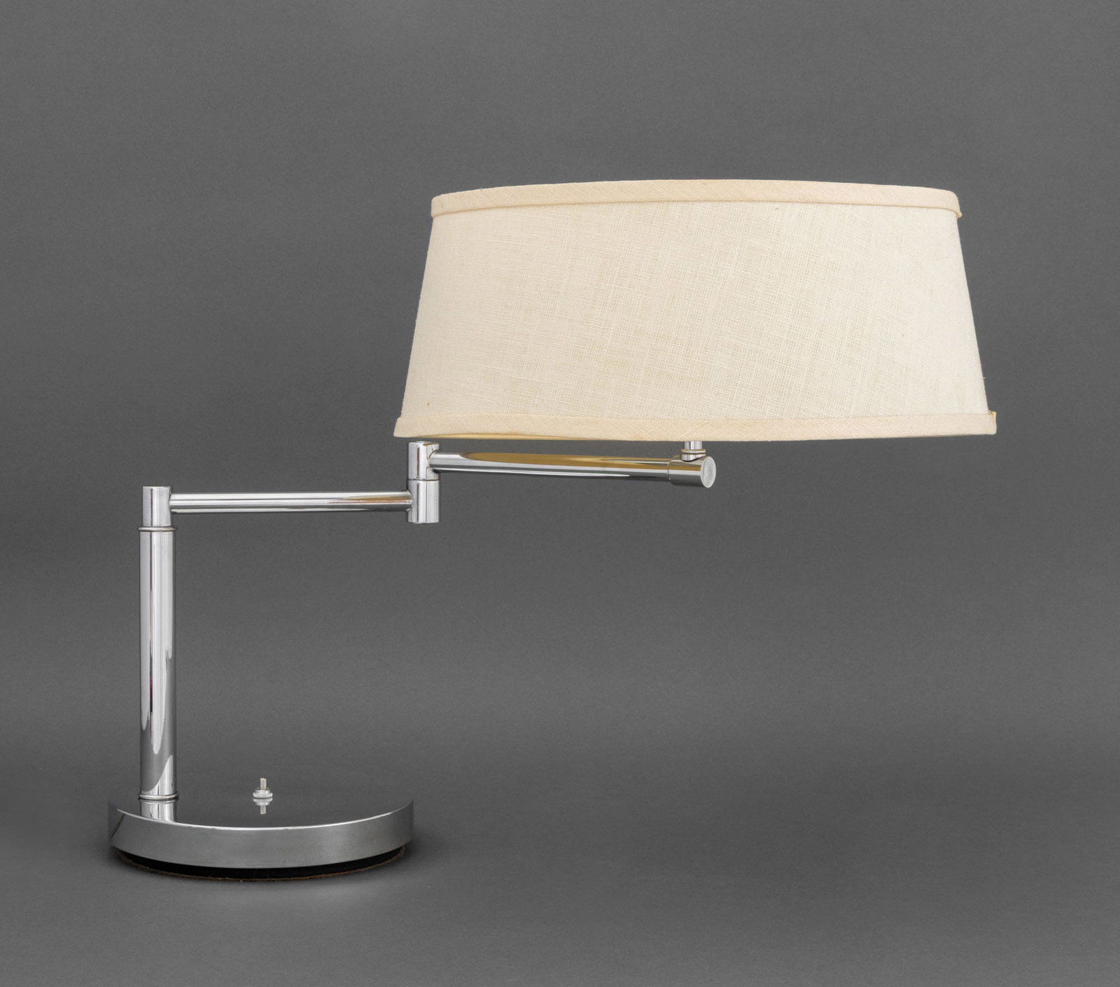 Mid-Century Modern Chrome Swing-Arm Table Lamp: Mid-Century Modern Chrome Swing-Arm Table Lamp, with two bulb fittings and an Artemis Studios white linen shade. Arm fully extended: 17.5" H x 26" W x 15" D. Provenance: An East 87th Street Collection