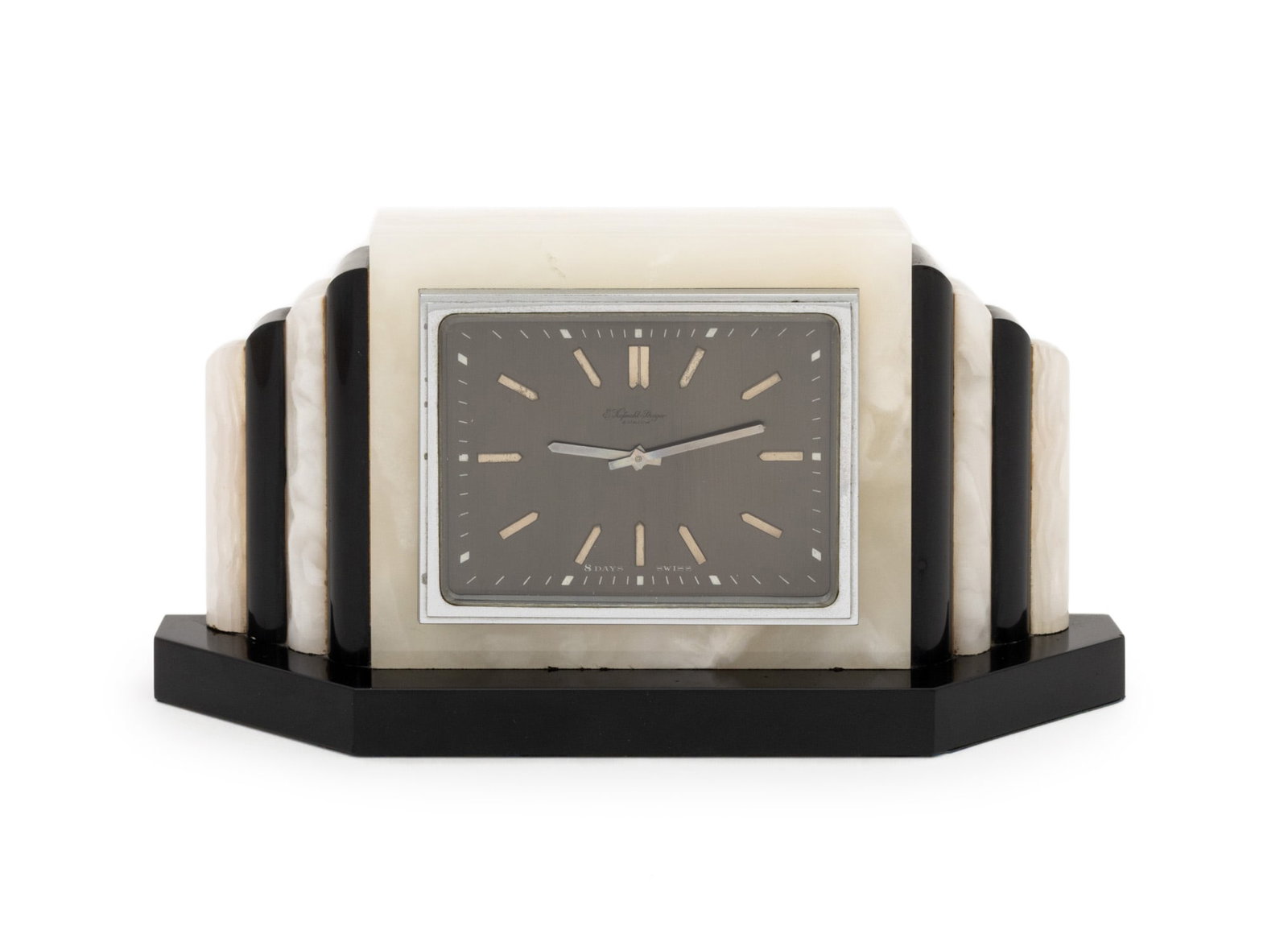 Swiss Art Deco Onyx Mantel Clock: Swiss Art Deco Onyx Mantel Clock, marked "E. Kofmehl-Steiger / Zurich / 8 Days / Swiss" to clock face, silver-tone hardware, fitted black stone base. 4.75" H x 9.25" W x 2.5" D. Provenance: From the E