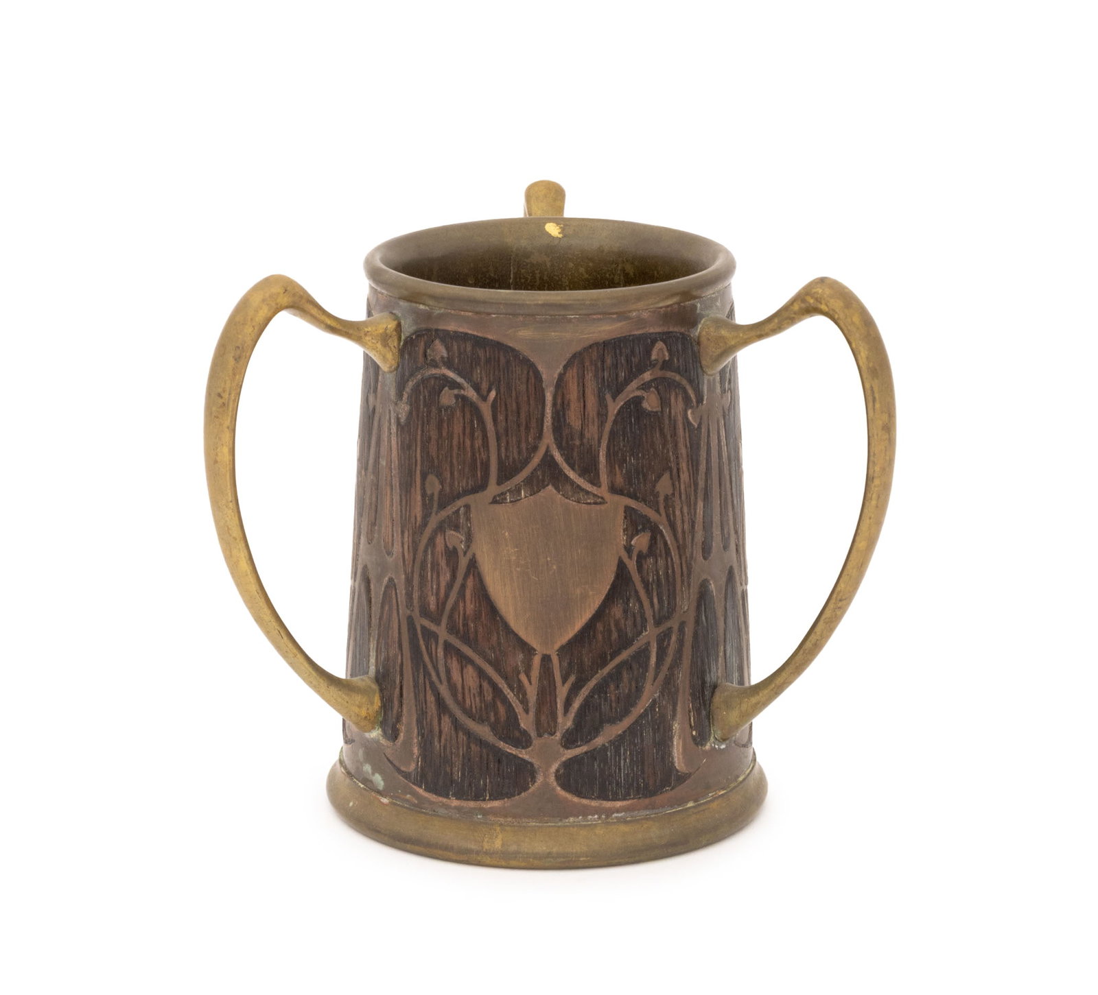 Arts & Crafts Oak and Brass Loving Cup, ca. 1900: Arts and Crafts Oak and Brass Loving Cup, circa 1900, brass shield form with empty cartouche to one face and three handles. 5.25" H x 6" Diameter. Provenance: From a New York City Collection.