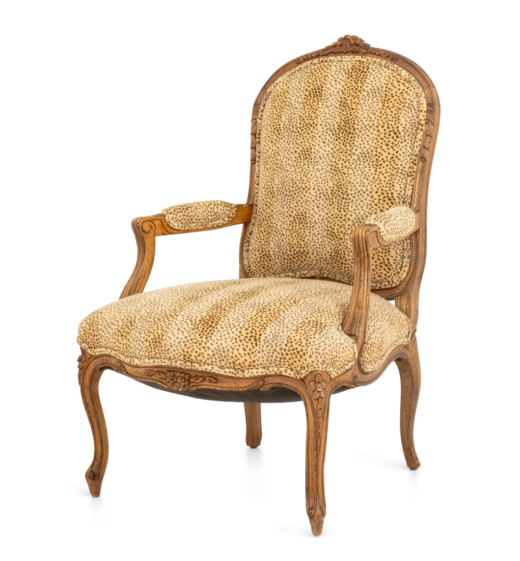 Louis XV Style Leopard Print Upholstered Fauteuil: 120Louis XV Style Leopard Print Upholstered Walnut Fauteuil, the cresting carved with floral rosettes. 39.5" H x 25.5" W x 22" D; seat: 16" H. Provenance: From an Upper East Side Estate. Keywords: Vin