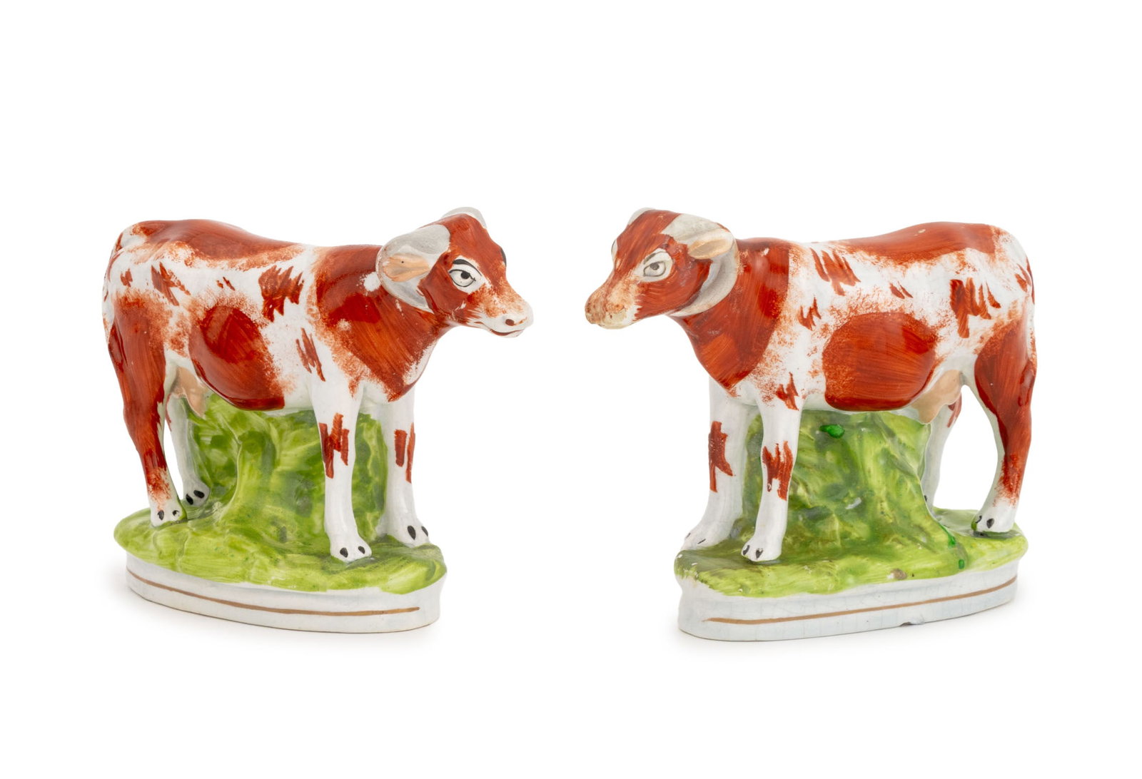 Staffordshire Standing Cow Sculptures, Pair: Pair of Staffordshire Standing Cow Sculptures, 19th century, hand-painted ceramic. 4.5" H x 5.75" W x 2.25" D. Provenance: A Brooklyn Heights, New York Estate. Keywords: English ceramics, Art
