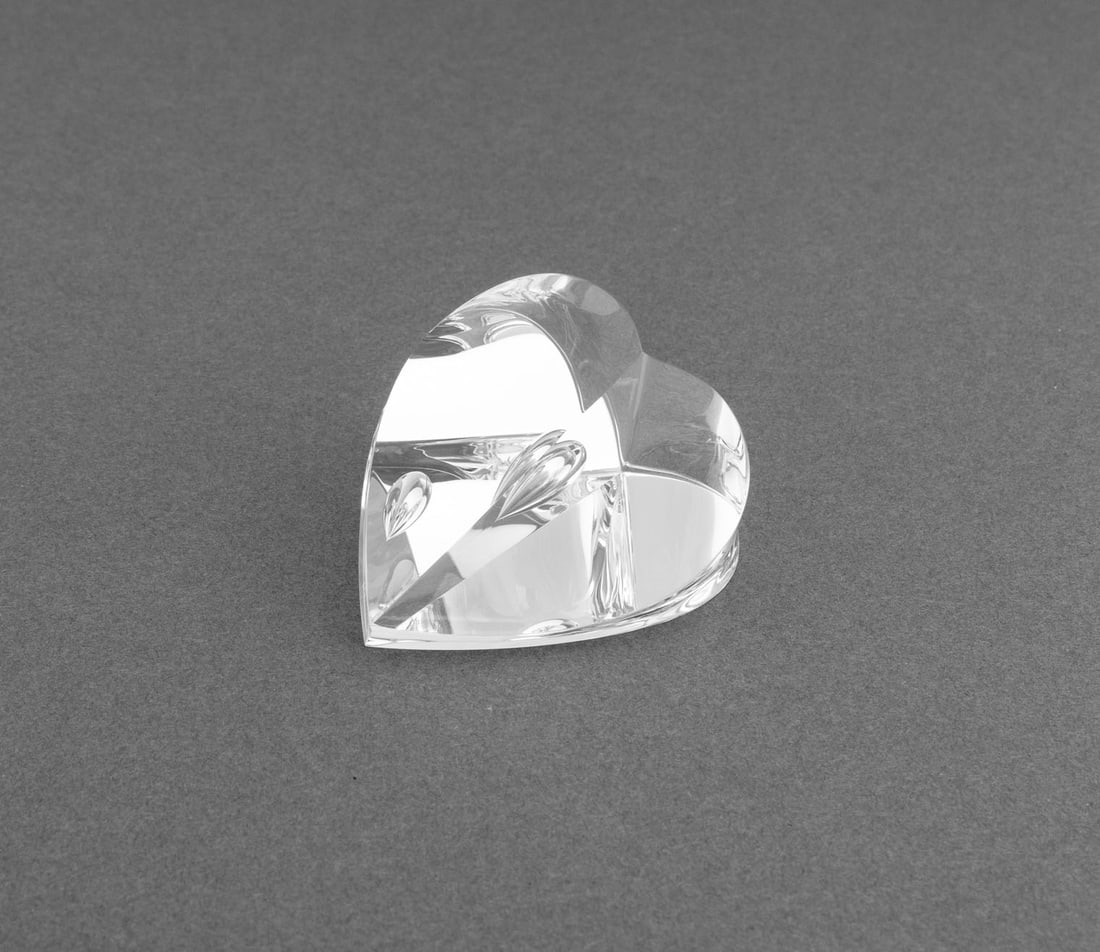 Steuben Crystal Heart Paperweight: Steuben Crystal Heart Paperweight, marked "S" to the side, in fitted red Steuben box. Paperweight: 1.5" H x 2.25" W x 2.25" D; overall: 2.25" H x 4.5" W x 5.25" D. Provenance: From the Fifth Avenue Es