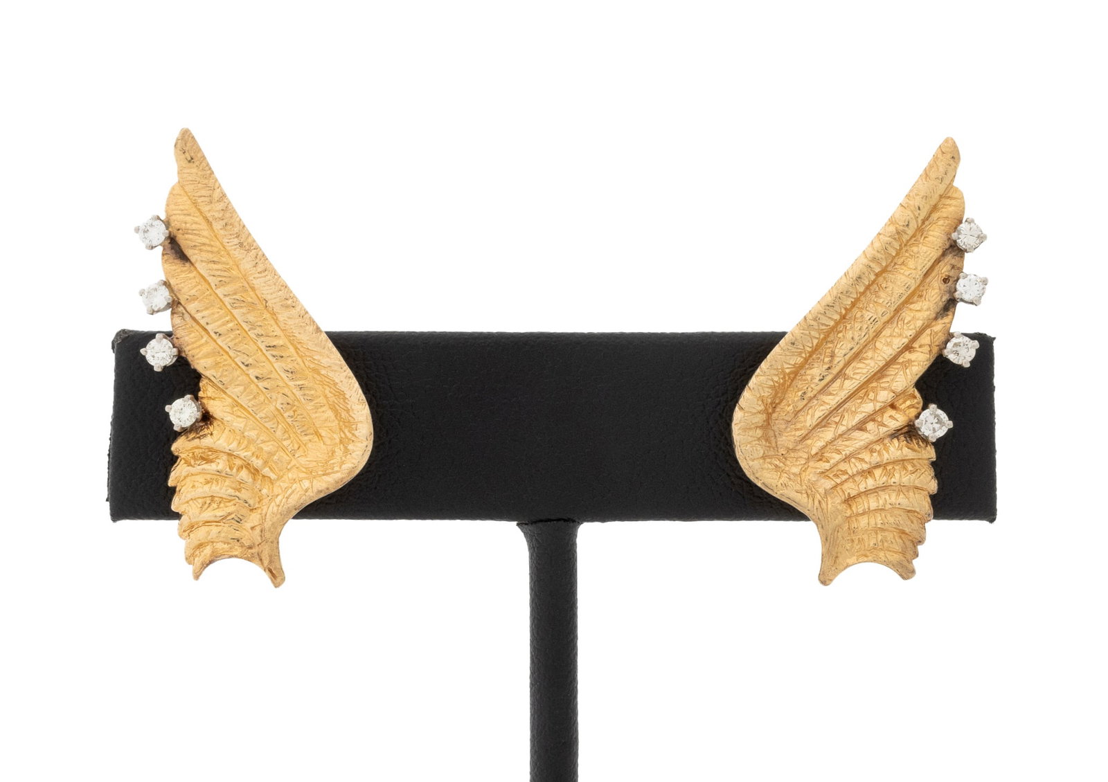 Wing Form Diamond and Yellow Gold Earrings: Pair of Wing Form 14K Yellow Gold and Diamond Earrings, adorned with eight prong set round brilliant cut diamonds weighing a total of approx. 0.25 carat, worn as clip-ons with omega backs and pads,