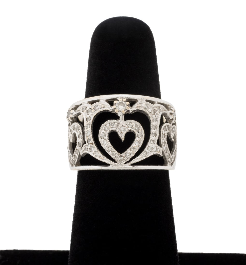 Heart Openwork Pave Diamond and White Gold Ring: 18K White Gold Heart Motif Openwork Pave Diamond Ring, designed with openwork hearts and ribbons, brightly polished and milgrain finished, adorned with sixty five pave set round faceted diamonds weigh