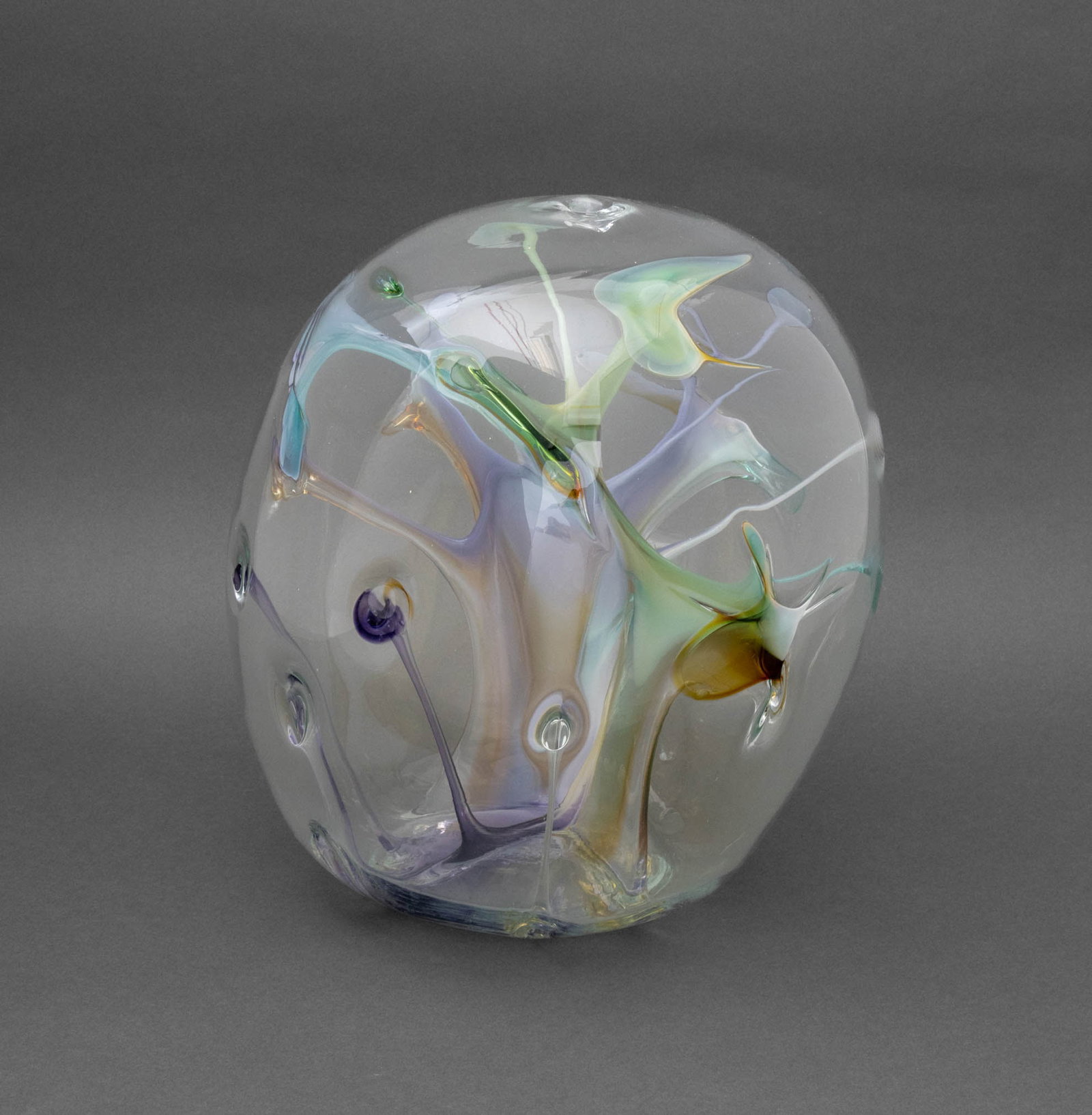 Paedra Bramhall Orb Glass Sculpture, 1986: Paedra Bramhall (Peter Bramhall, American, b. 1942) Orb Glass Sculpture, 1986, colorless glass with internal polychrome stem forms, signed, dated, and inscribed "Peter Bramhall / 21 June 1986 / Help