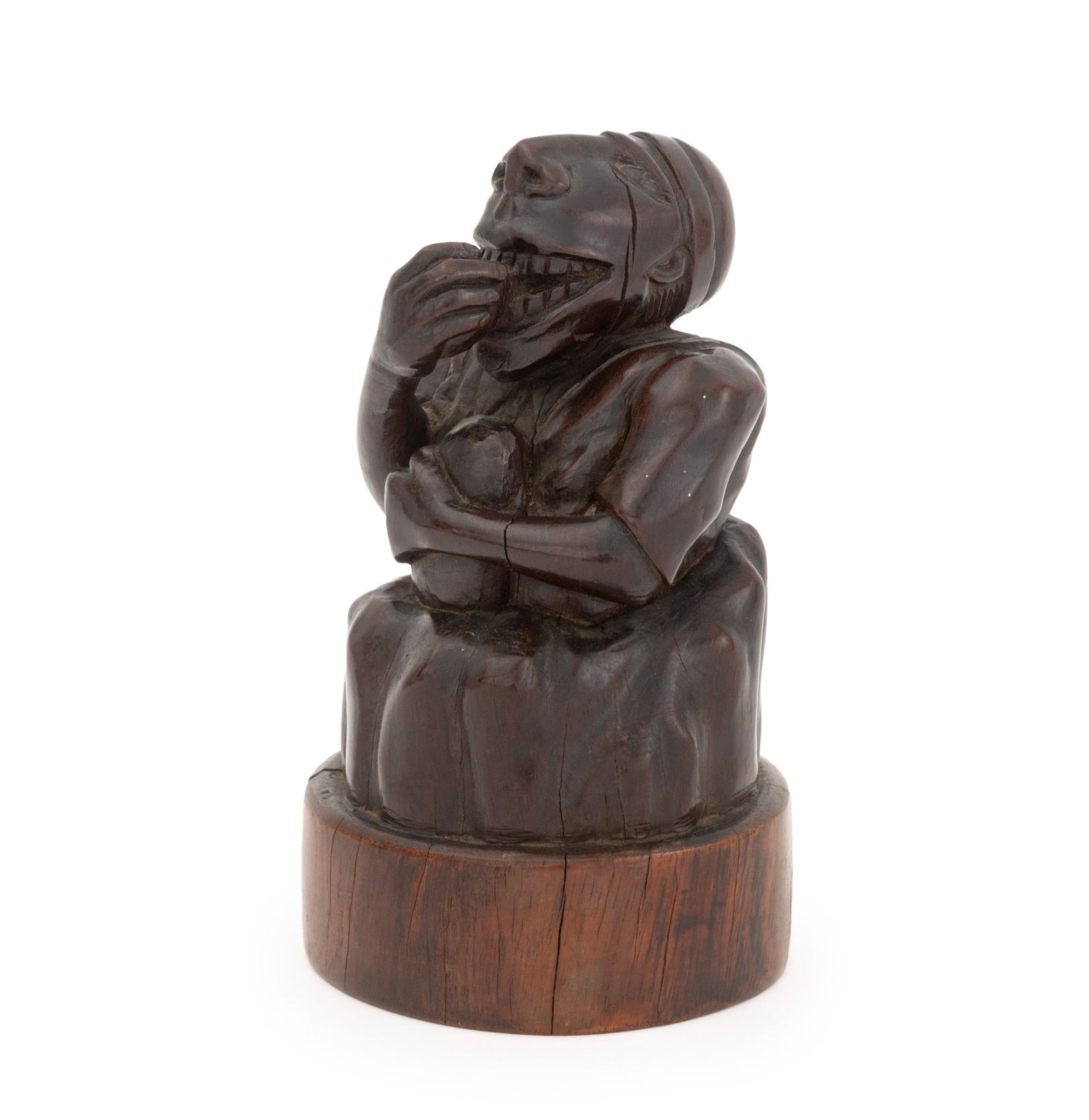 David S. Miller Figural Carved Wood Sculpture: David S. Miller (Jamaican, 1903-1977) Figural Carved Wood Sculpture, depicting a seated woman eating food, signed and inscribed "By / David. S. Miller. / Kingston, / Jamaica. / B.W.I." to underside.
