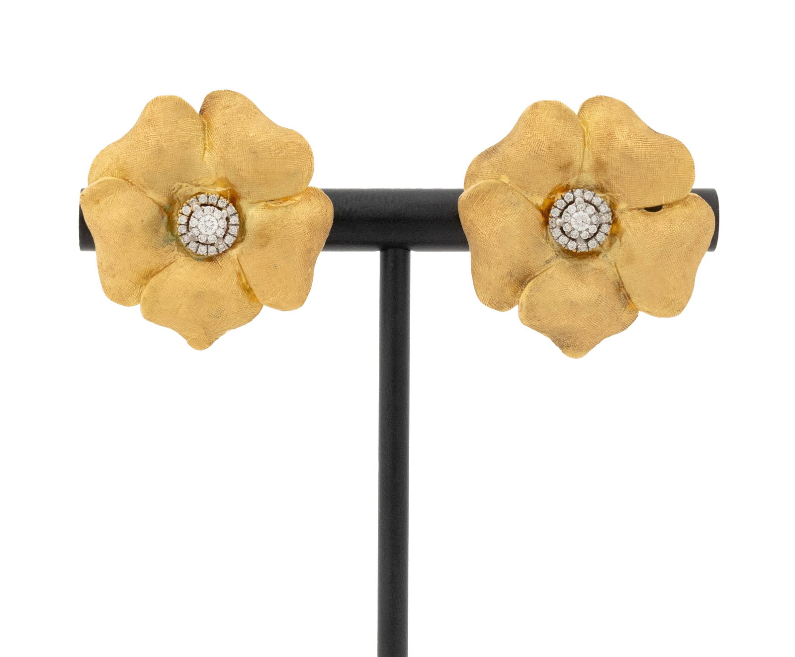 Floriform Yellow Gold and Diamond Earrings: Pair of Flower Form 14K Yellow Gold and Diamond Earrings, featuring fifty two prong set round brilliant cut diamonds weighing a total of approx. 0.25 carat, worn through pierced earlobes with posts an