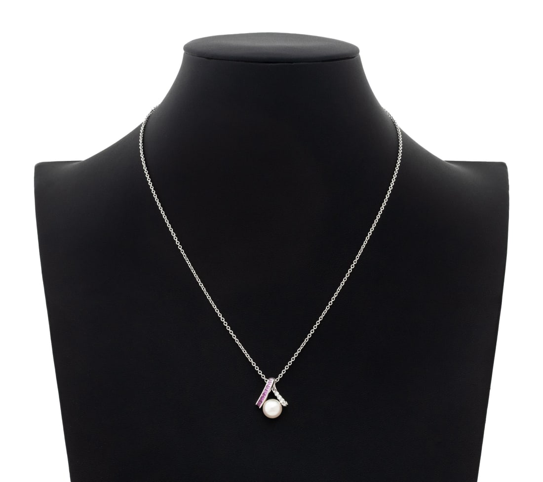 Mikimoto Pearl, Pink Sapphire, & Diamond Necklace: Mikimoto Akoya Pearl, Pink Sapphire, Diamond, and 18K White Gold Pendant Necklace, decorated with one round Akoya cultured pearl approx. 8.2 mm., further adorned with nine channel set calibre cut squa