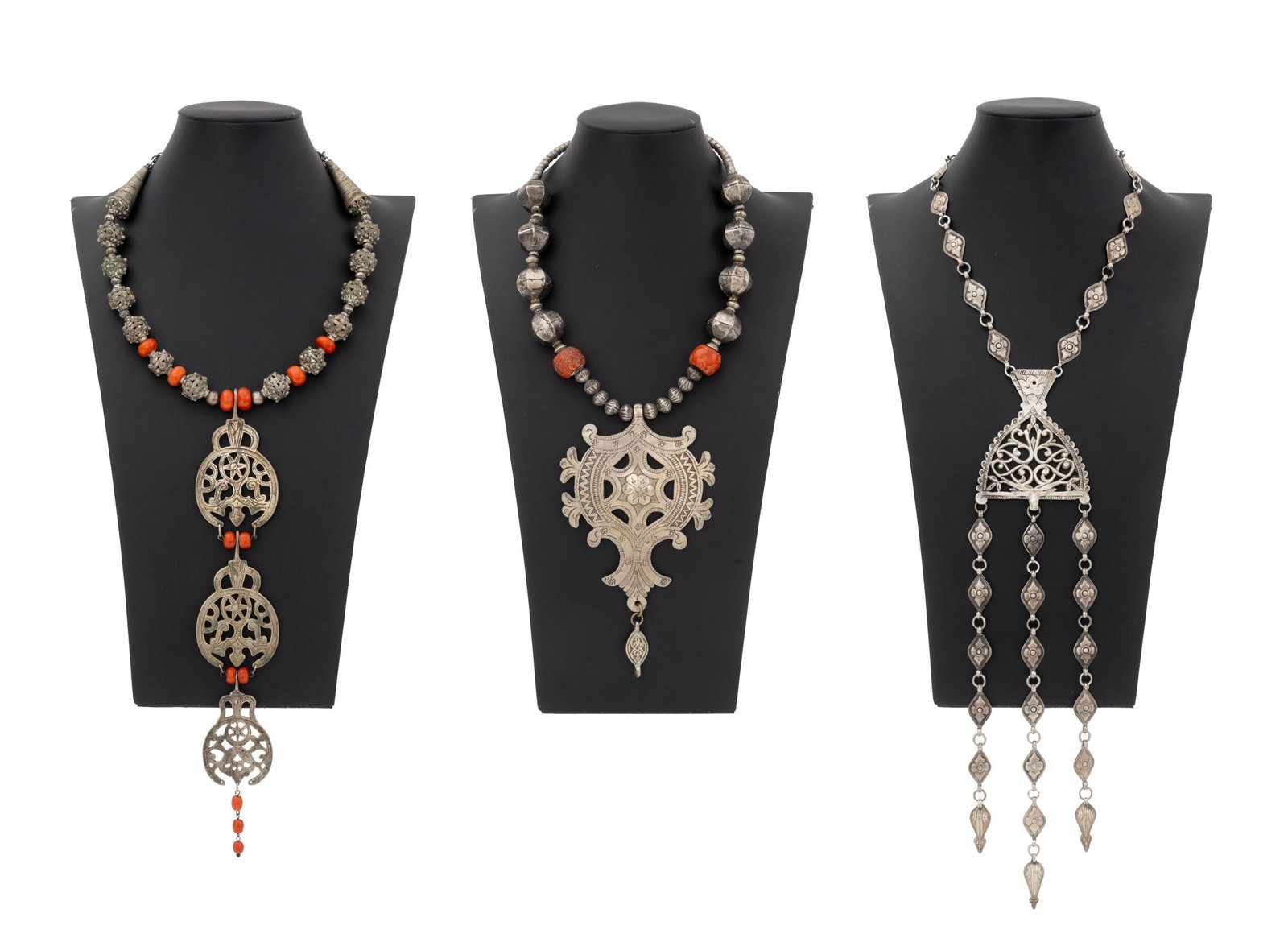 Irena Corwin Silver and Red Coral Necklaces, 3: Irena Corwin (American, XX) Collection of Three Silver Necklaces, two with red coral beads, some silver beads Indian, Yemeni, and Turkmen. Weight: 16.60 ozt. inclusive; largest: 19" W x 12.75" L. Prov