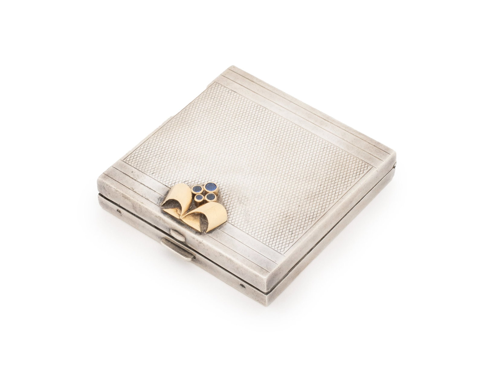 Tiffany & Co. Sapphire-Set Sterling Silver Compact: Tiffany and Company Art Deco Sapphire Mounted Sterling Silver Compact Mirror, adorned with four blue sapphire cabochons, marked "Tiffany & Co." inside and "Sterling" to exterior edge reverse. Weight: 