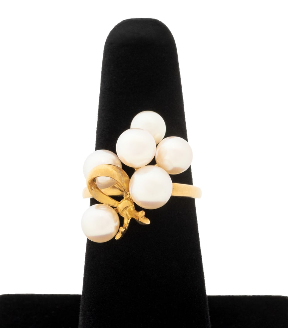 Mikimoto Akoya Pearl and Yellow Gold Ring: Mikimoto 18K Yellow Gold and Cultured Akoya Pearl Cluster Ring, adorned with six round Akoya pearls approx. 5.5 - 7.0 mm., marked: "{M} K18". Measuring approx. US size 6, 3.7 dwt. inclusive. Provenanc
