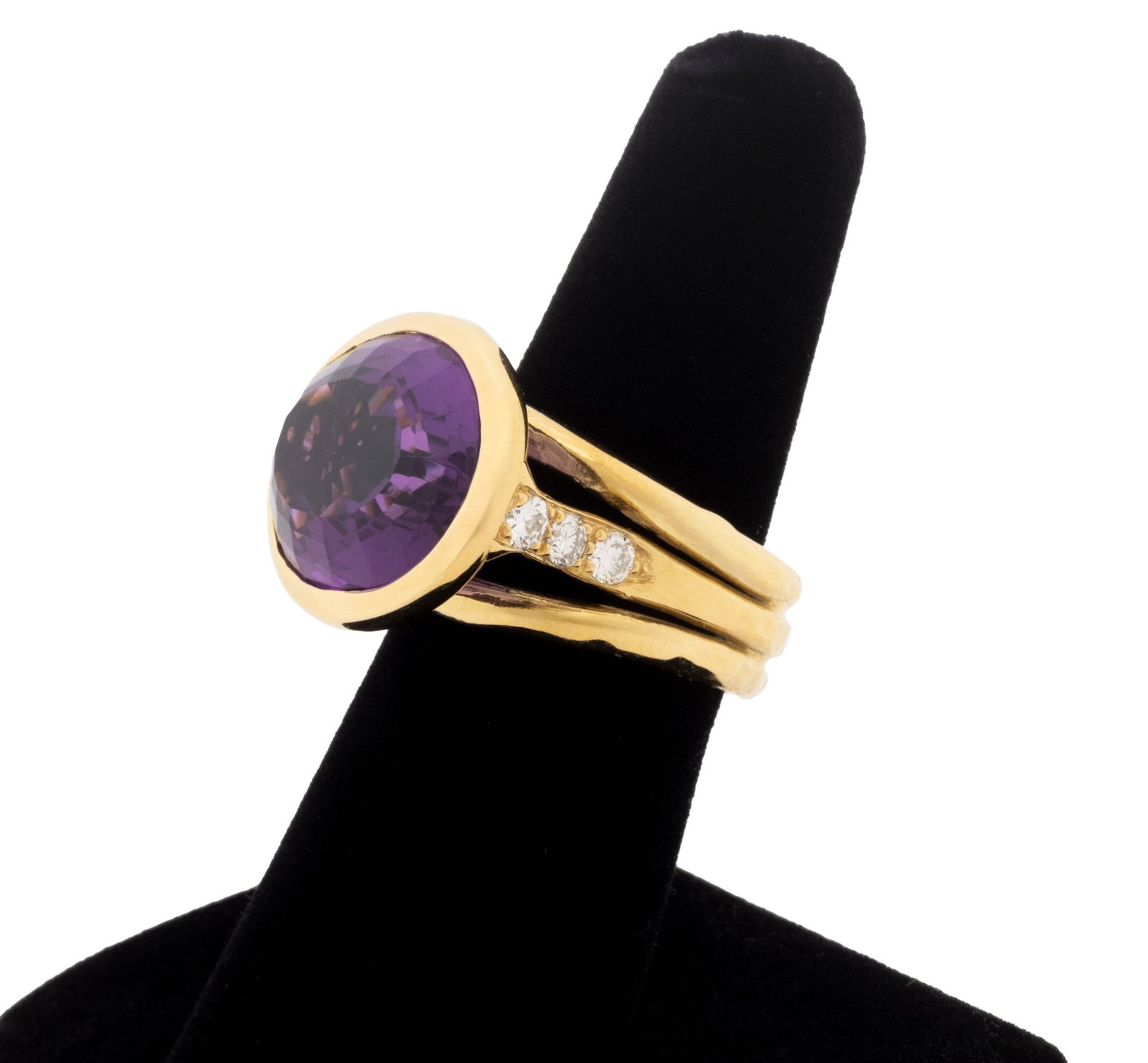 Amethyst, Diamond, and 18K Yellow Gold Ring: 18K Yellow Gold, Amethyst, and Diamond Ring, featuring one bezel set oval mixed cut amethyst weighing approx. 15.75 carats, further adorned with six bead set round brilliant cut diamonds weighing a to