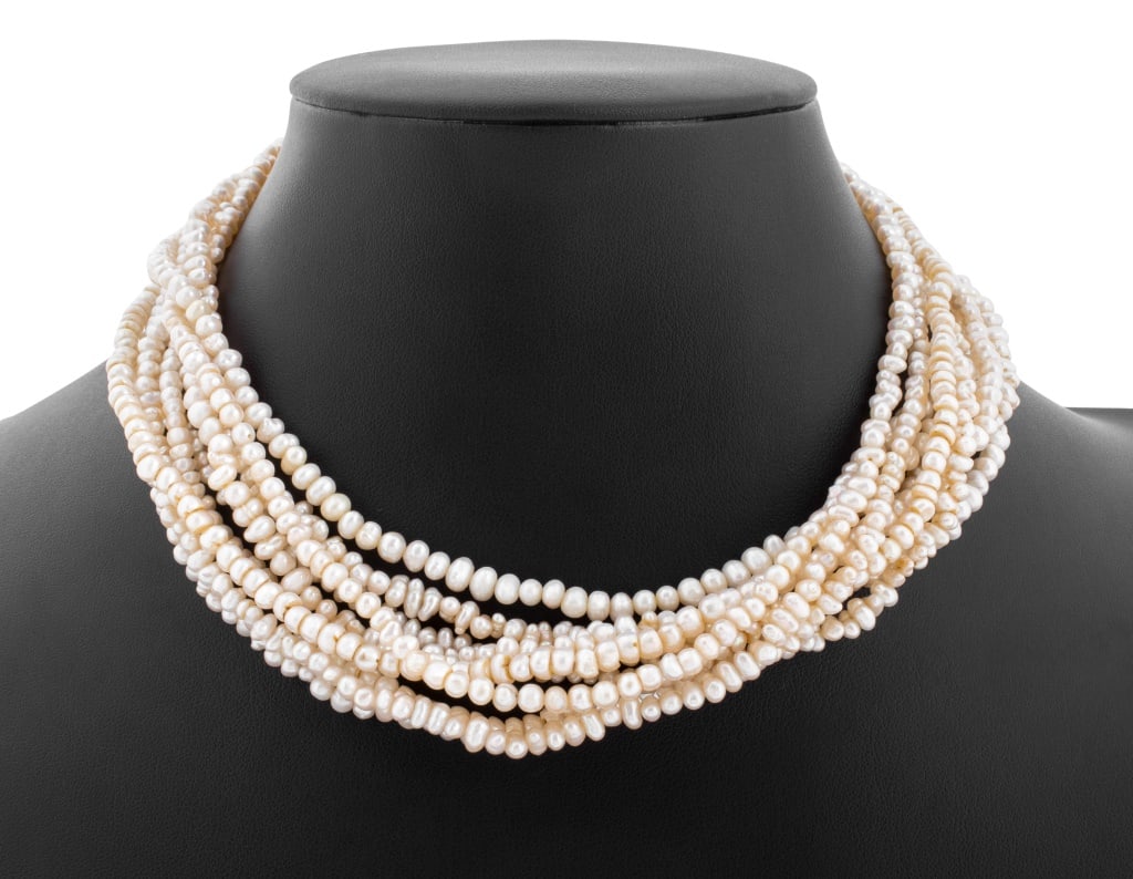Pearl Necklace with Emerald, Diamond, & Gold Clasp: Multi-Strand Pearl Necklace with 14K Emerald, Diamond, and 14K Gold Clasp, 9 strands of cultured semi baroque pearls approx. 3.0 4.5 mm, joined with 14K yellow gold box and tongue clasp, adorned with 