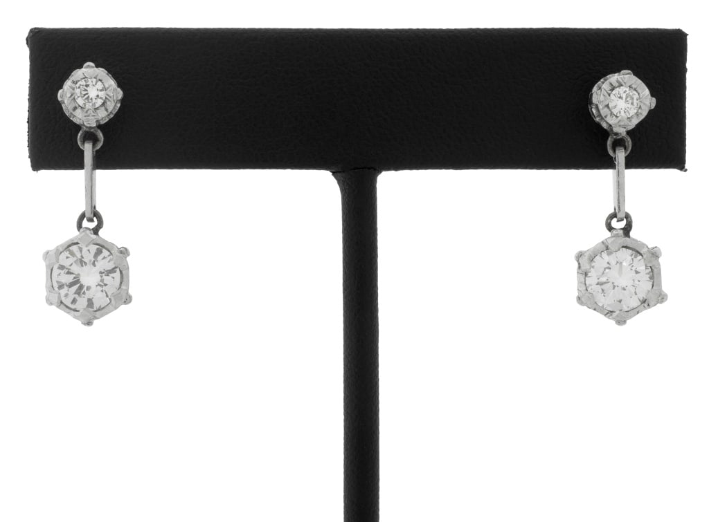 Vintage Retro Platinum and Diamond Drop Earrings: Pair of Vintage Retro Platinum and Diamond Drop Post Earrings, set with four round brilliant-cut diamonds; total weight approx: 2.20 carats, color: H-I, clarity: VS. Larger diamonds are approx: 1.00 c