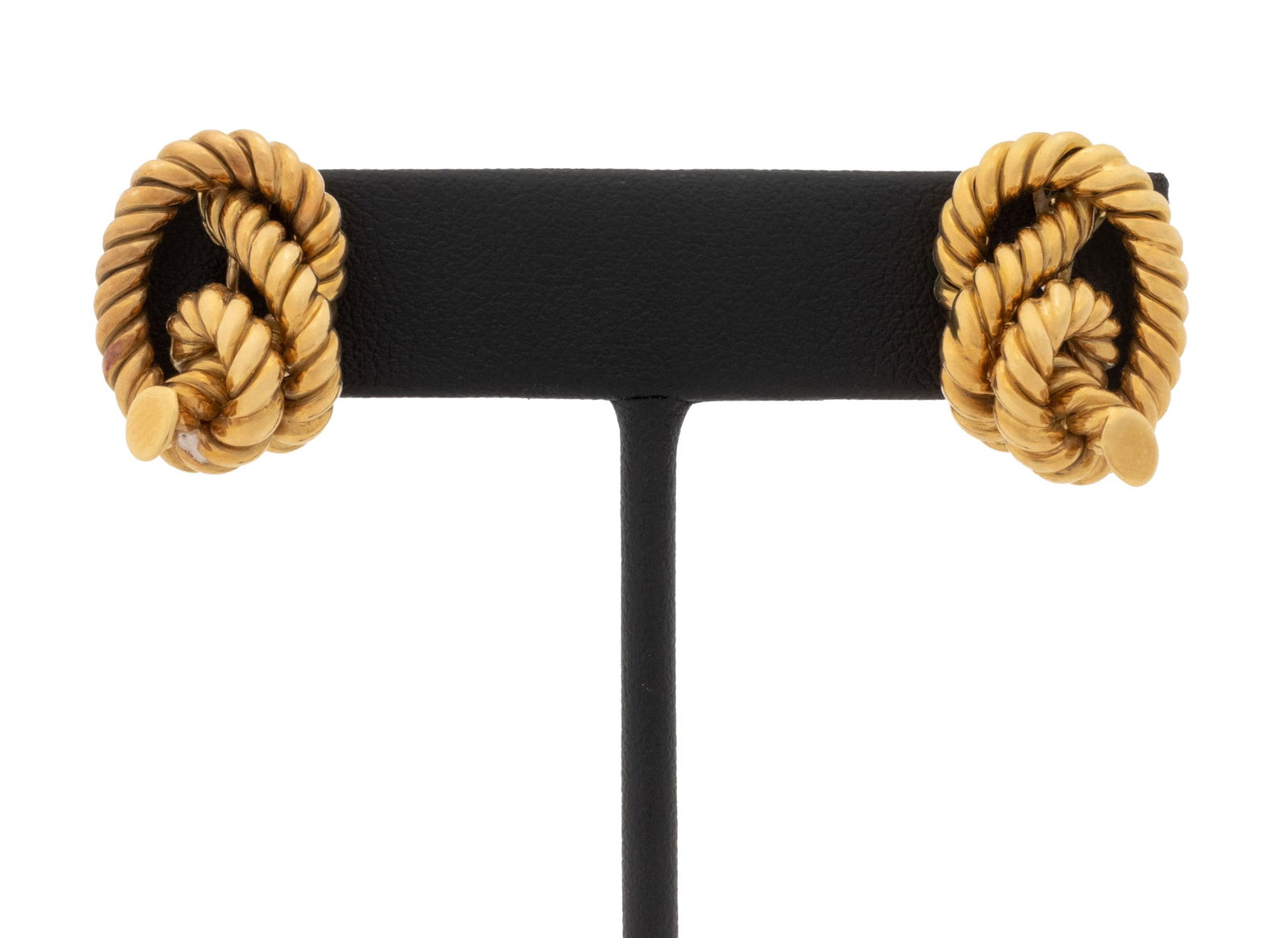 Rope Knot Motif 18K Yellow Gold Earrings: Pair of Rope Knot Motif 18K Yellow Gold Earrings, featuring two fluted wire knots designed to give the appearance of double knotted ropes, worn through pierced earlobes with posts and omega backs, mar