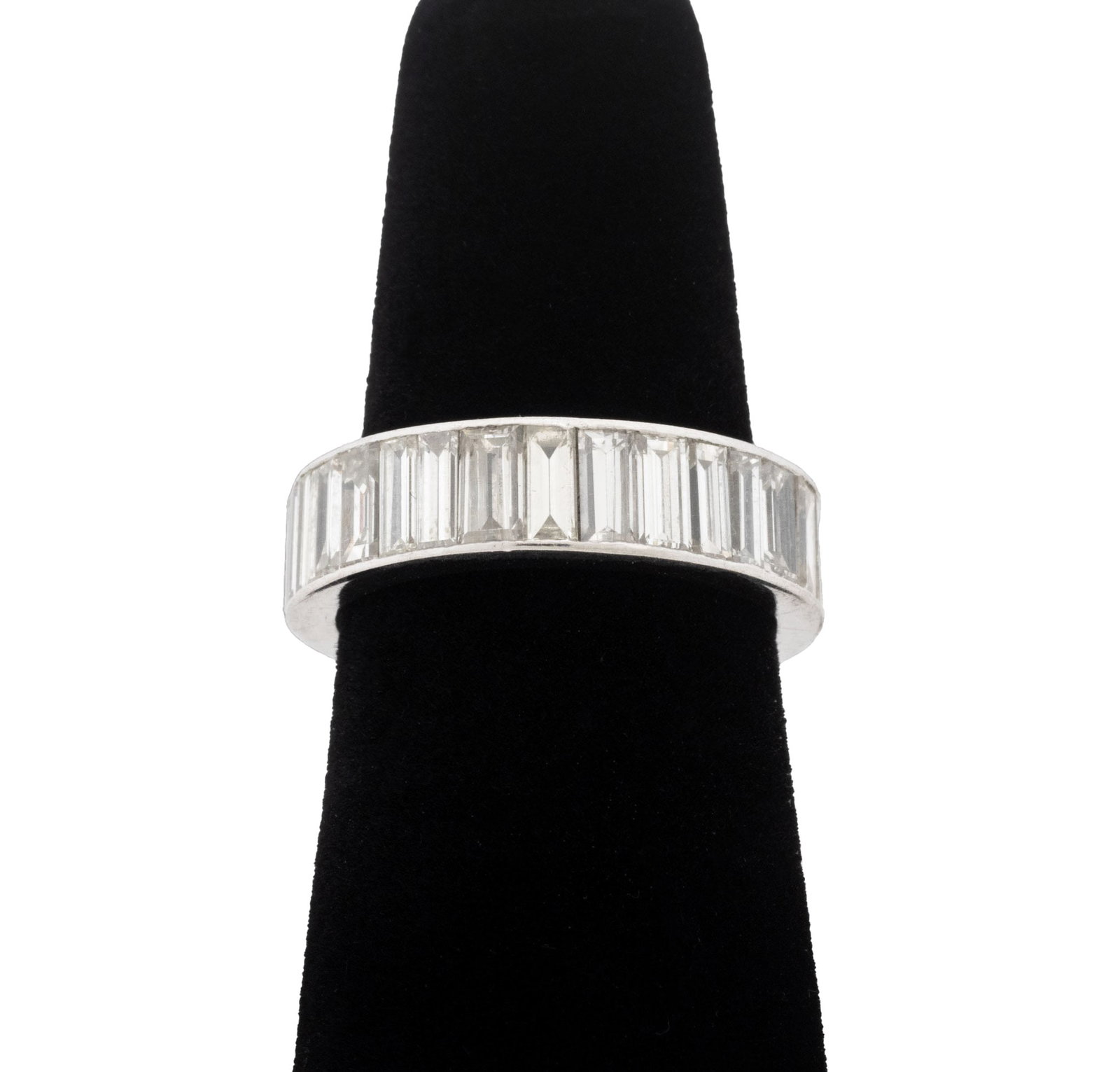 Platinum and Baguette Diamond Eternity Band: Platinum and Baguette Diamond Eternity Band, featuring thirty six channel set baguette diamonds weighing a total of approx. 5.00 carats, I-J color / VS - SI clarity. Platinum tested. Measuring