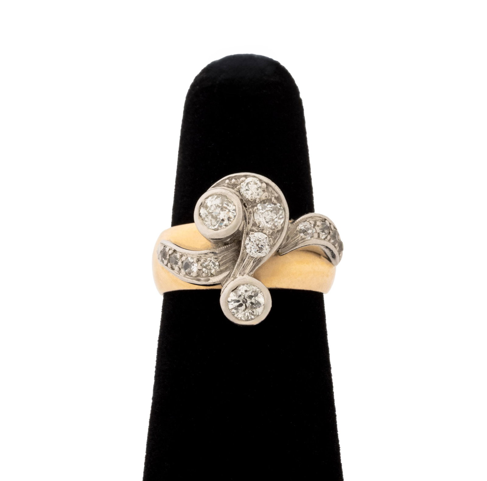 Vintage Two-Tone Gold and Diamond Ring: Vintage 14K Yellow Gold and White Gold Diamond Ring, featuring twelve white gold bezel and pave set round brilliant cut diamonds weighing a total of approx. 0.72 carat, with yellow gold 6.5 mm. band, 