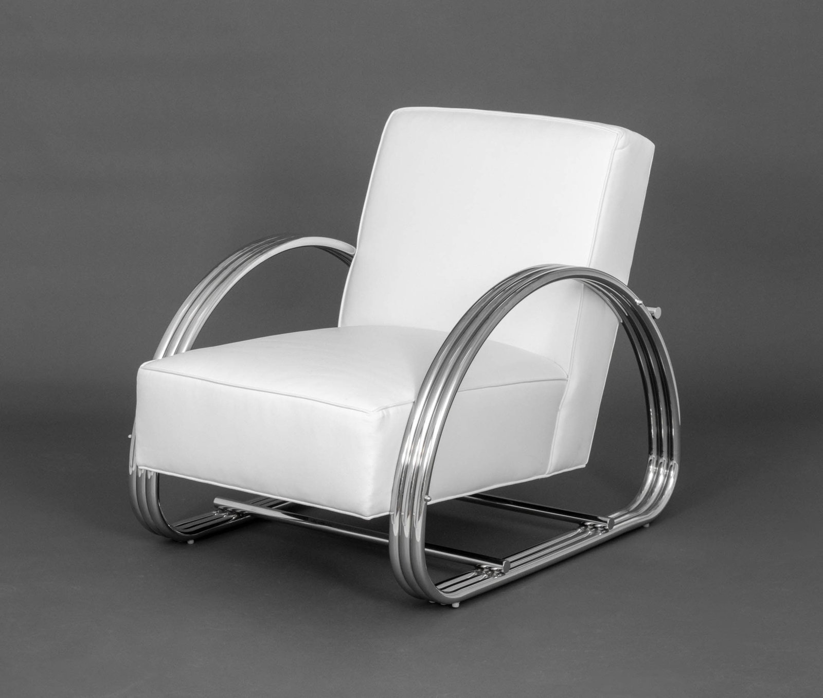 Ralph Lauren "Hudson Street" Lounge Chair: Ralph Lauren "Hudson Street" Lounge Chair, with white leather upholstery and polished stainless steel frame, "E.J. Victor, Inc." label to underside. 34" H x 29" W x 36" D; seat: 16" H. Provenance: Fro