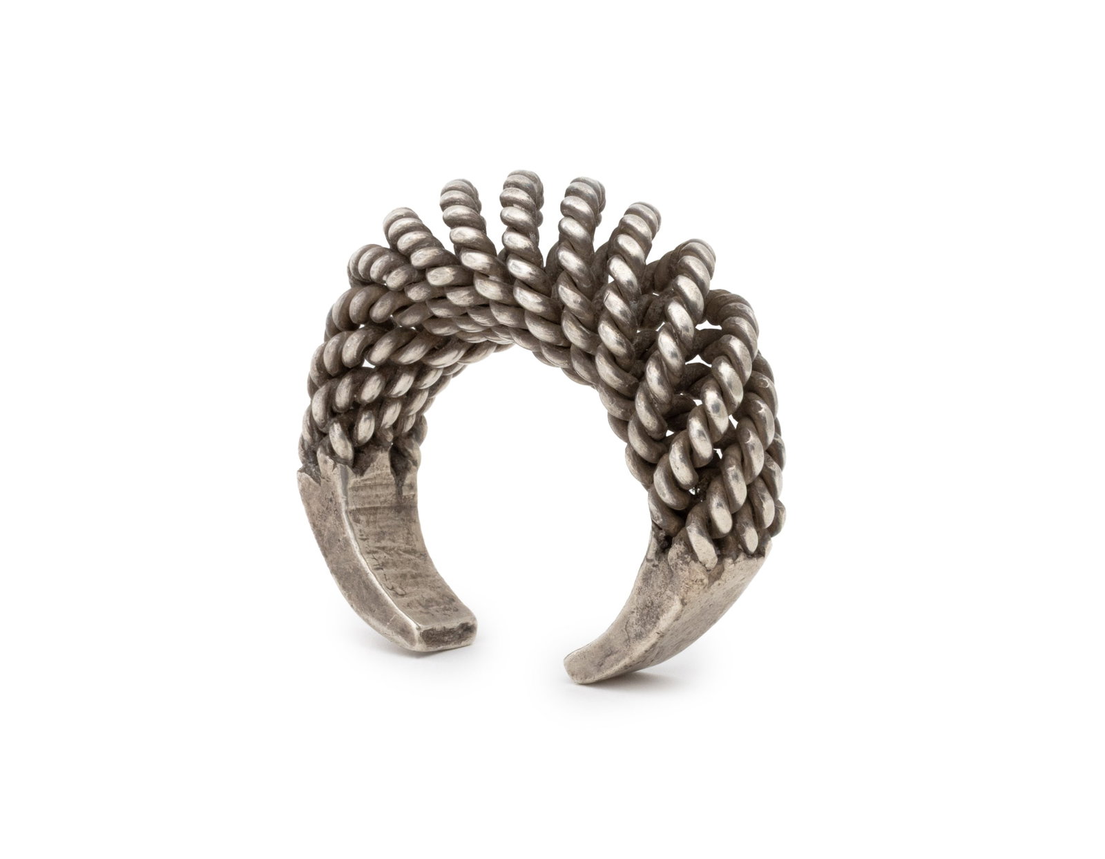 Akha Hill Tribe Rope Twist Motif Silver Cuff: Akha Hill Tribe Rope Twist Motif Reticulated Silver Cuff. Weight: 6.74 ozt.; 3.25" L x 2.75" W x 1.25" D. Provenance: From the Estate of Jewelry Designer Irena Corwin. Keywords: Sino-Tibetan Art, Anti