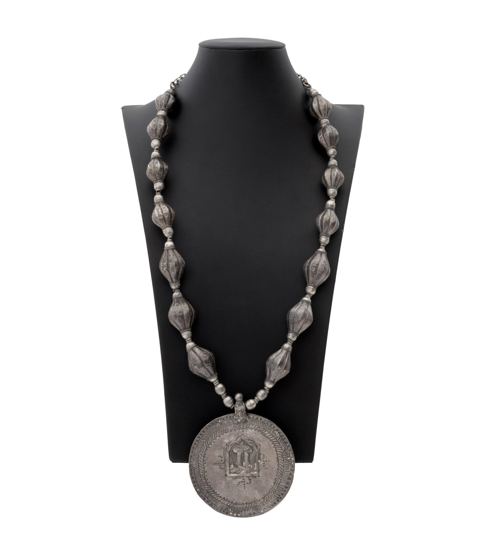 Irena Corwin Divine Footprints Silver Necklace: Irena Corwin (American, XX) Indian Rajasthani Silver Paduka Divine Footprints Pendant Necklace, the pendant reverse with 1862 Rupee silver coin, strung with African silver melon beads. Weight: 7.36 oz