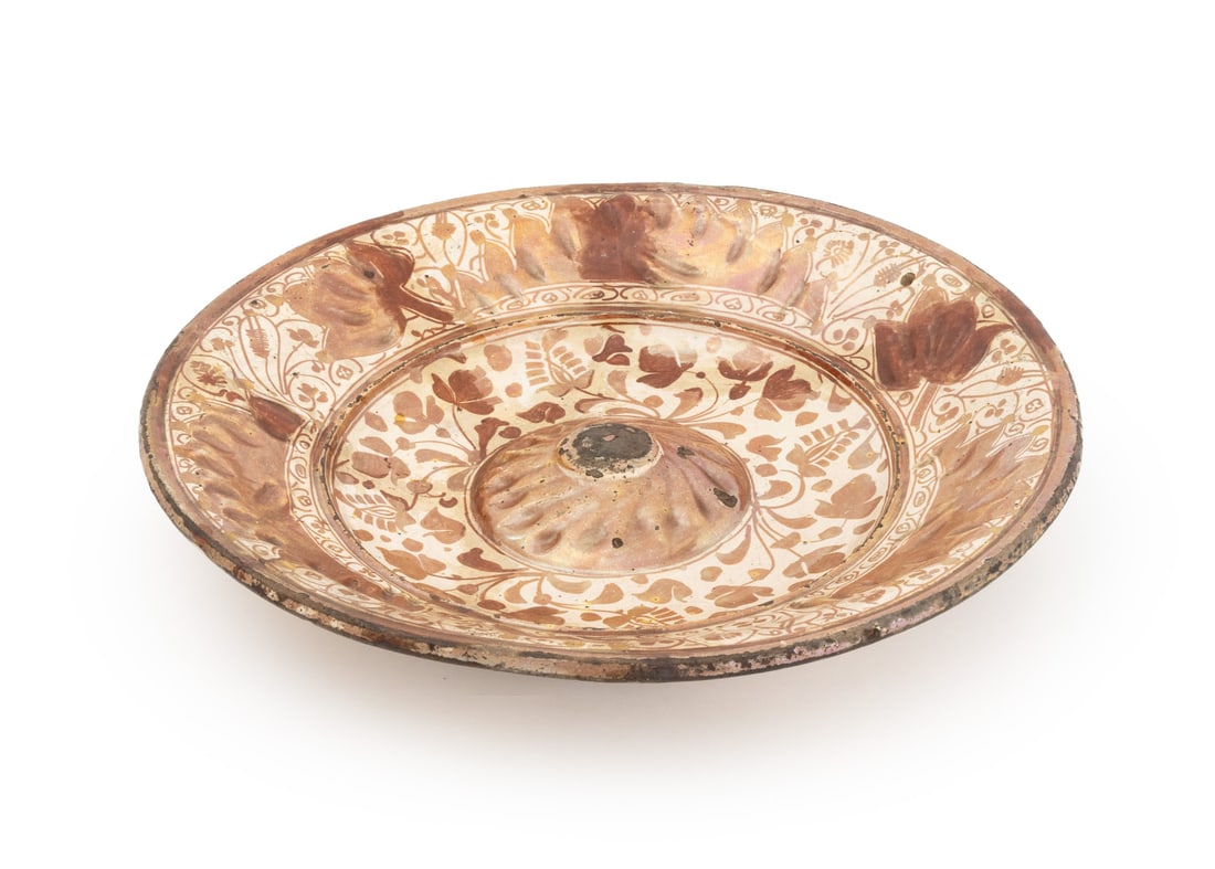 Hispano-Moresque Copper Luster Charger, 16th C.: Hispano-Moresque Copper Luster Charger, Manises, Spain, 16th century, decorated with scrolling foliate motifs. 3" H x 15.75" Diameter. Provenance: Andre Tressley, New York, Parke-Bernet, 22 November 1