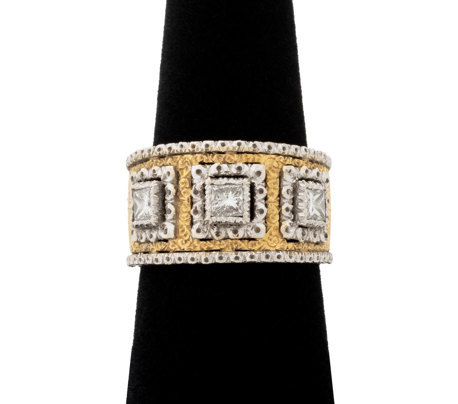 Mario Buccellati Yellow & White Gold Diamond Band: Mario Buccellati 18K Yellow Gold and White Gold Diamond Band Ring, adorned with three bezel set princess cut diamonds weighing a total of approx. 0.60 carat, G-H color / VS clarity, textured and brigh