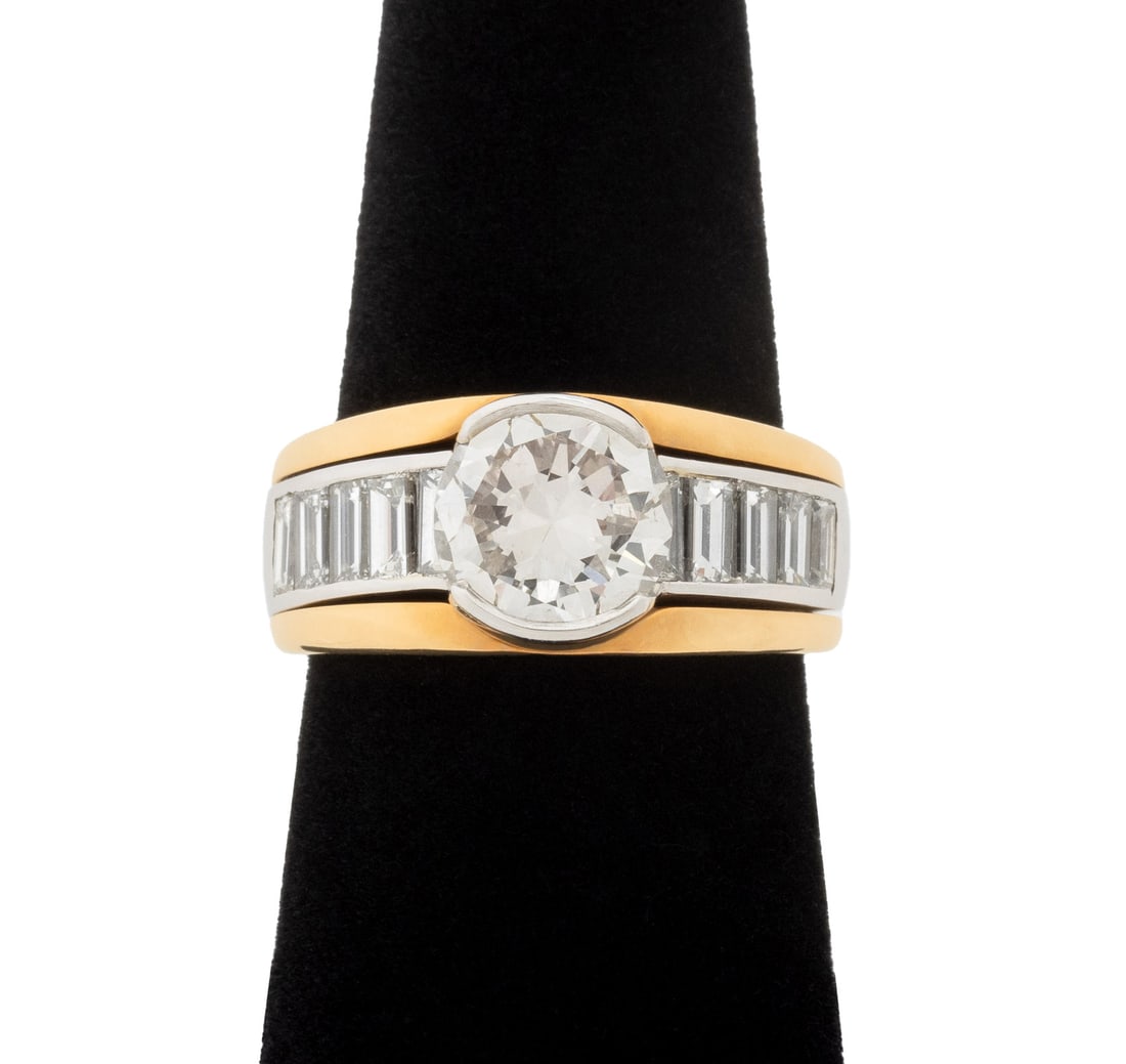 Vintage Platinum, 18K Gold, and Diamond Ring: Vintage Platinum, 18K Yellow Gold, and Diamond Ring, featuring one partial bezel set round brilliant cut diamond, weighing approx. 2.01 carats, H color / VS2 clarity, further adorned with ten channel 