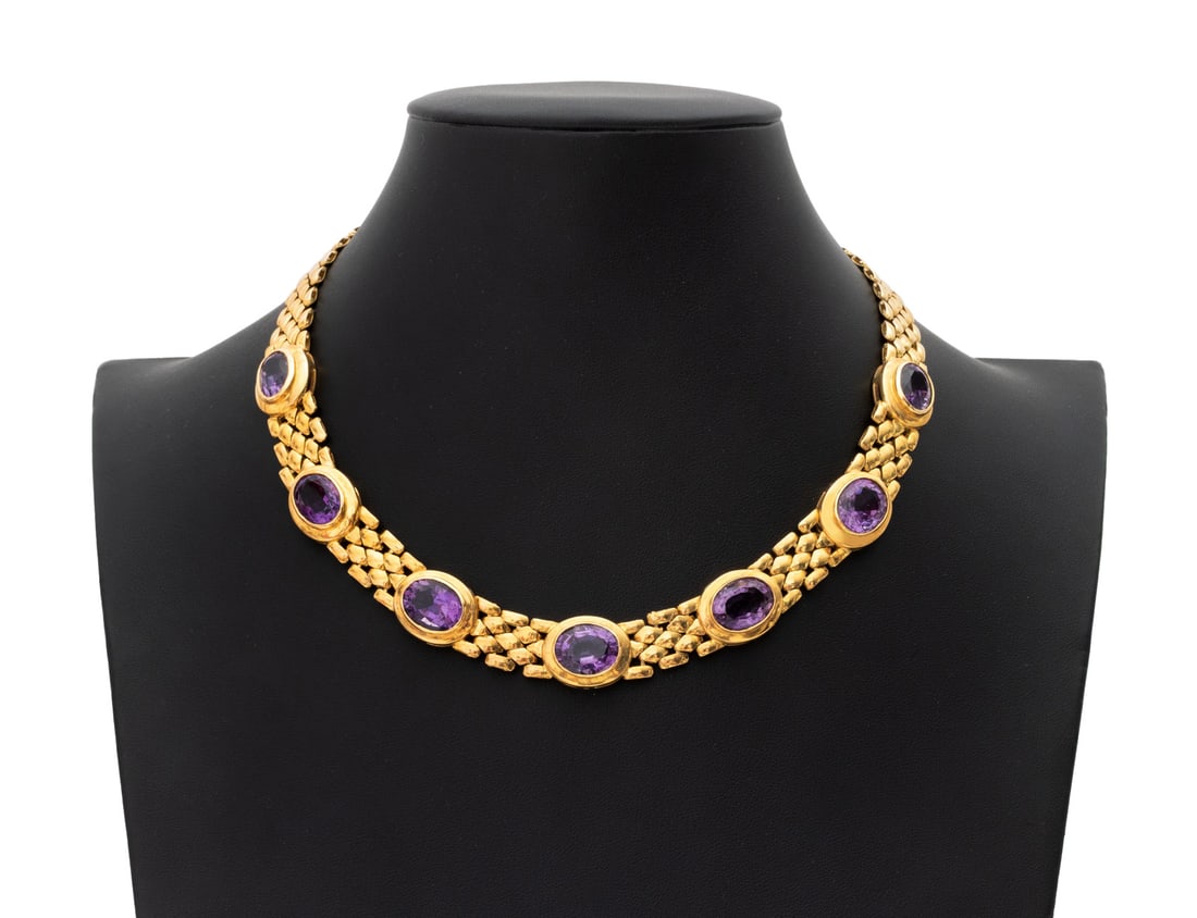 18K Yellow Gold and Amethyst Necklace: 18K Yellow Gold and Amethyst Necklace, featuring seven bezel set oval brilliant amethysts weighing a total of approx. 35.00 carats, joined with box and tongue clasp including wire figure 8 safety clas