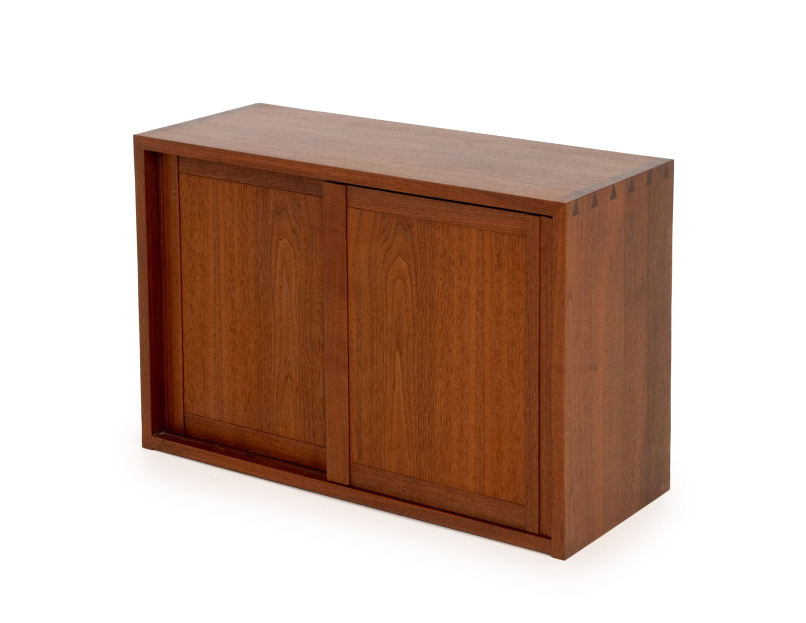 George Nakashima Walnut Hanging Cabinet, 1978: George Nakashima (American, 1909-1990) Walnut Wall-Hanging Cabinet, 1978, with two sliding doors opening to shelves, accompanied by an original drawing. 20" H x 30" W x 12" D. Provenance: Commissioned