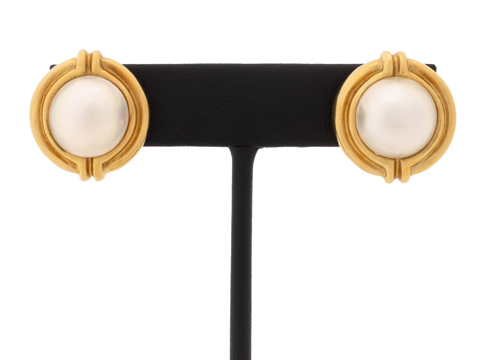 Tiffany & Co. 18K Gold and Mabe Pearl Earrings: Pair of Tiffany and Company 18K Yellow Gold and Mabe Pearl Earrings, designed as fluted circular forms, decorated with two round mabe pearls approx. 13.2 mm., worn through pierced ears with posts and