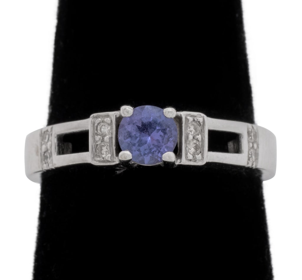 Levian 18K White Gold, Tanzanite, and Diamond Ring: Levian 18K White Gold, Tanzanite, and Diamond Ring, featuring one prong set round brilliant tanzanite weighing approx. 0.25 carats, further adorned with eight bead set round brilliant cut diamonds wei