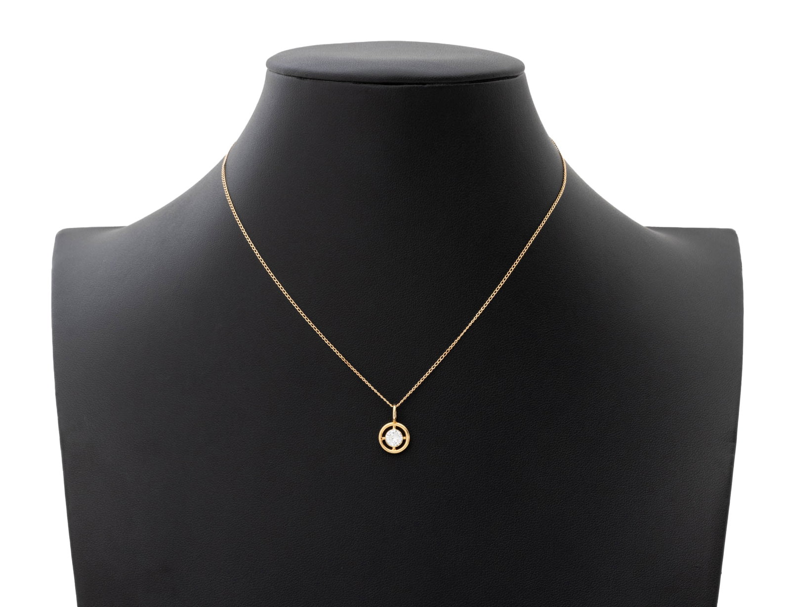 Yellow Gold and Diamond Solitaire Pendant Necklace: 14K Yellow Gold and Diamond Solitaire Pendant Necklace, featuring one white gold bezel set round round faceted diamond weighing approx. 0.40 carat, I-J color / SI2 clarity, pendant detachable from fin
