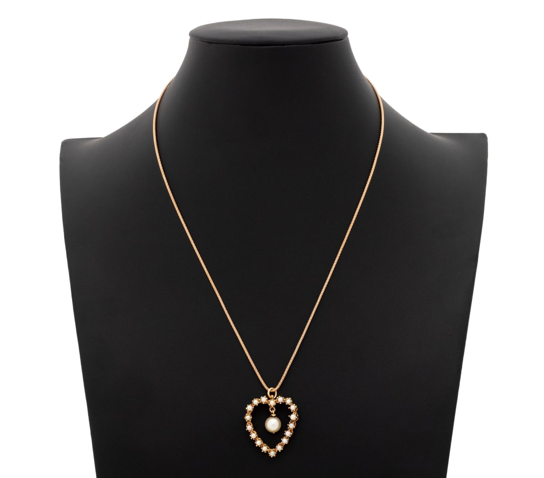 Pearl Heart Form Pendant on Rose Gold Necklace: 14K Gold and Pearl Heart Form Pendant on 10K Rose Gold Necklace, featuring one detachable pendant decorated with 18 prong and 1 post set round cultured pearls approx. 3.0 - 7.6 mm., framed with heart 
