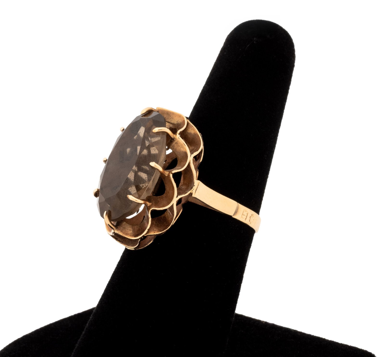 Yellow Gold and Smokey Quartz Solitaire Ring: 14K Yellow Gold and Solitaire Smokey Quartz Ring, featuring one prong set oval brilliant cut smokey quartz weighing approx. 8.88 carat, marked: "14K" with logos. Measuring approx. US size 7, 3.6 dwt. 