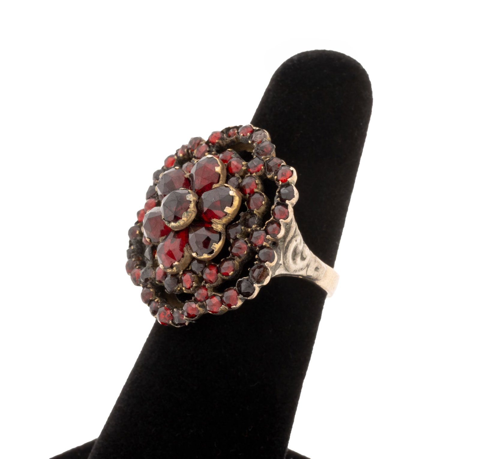 Victorian Gold, Silver, and Garnet Cluster Ring: Victorian 14K Yellow Gold, Sterling Silver, and Garnet Cluster Ring, designed with 14K yellow gold shank and sterling silver settings, featuring fifty eight prong set rose cut garnets weighing a total
