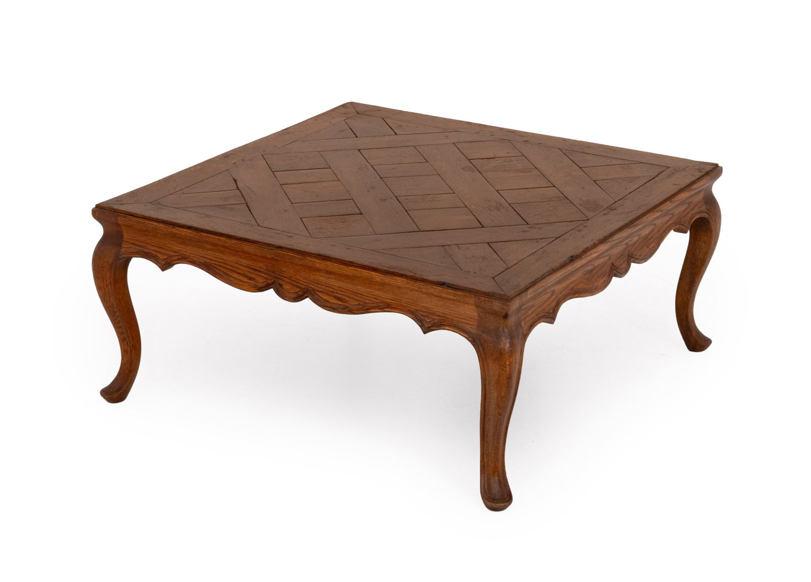 French Provincial Oak Coffee Table: French Provincial Oak Coffee Table, with parquetry design to the top above cabriole legs. 17" H x 37.75" H x 38.25" D. Provenance: From a Central Park West Collection. Keywords: Vintage Furniture, Low
