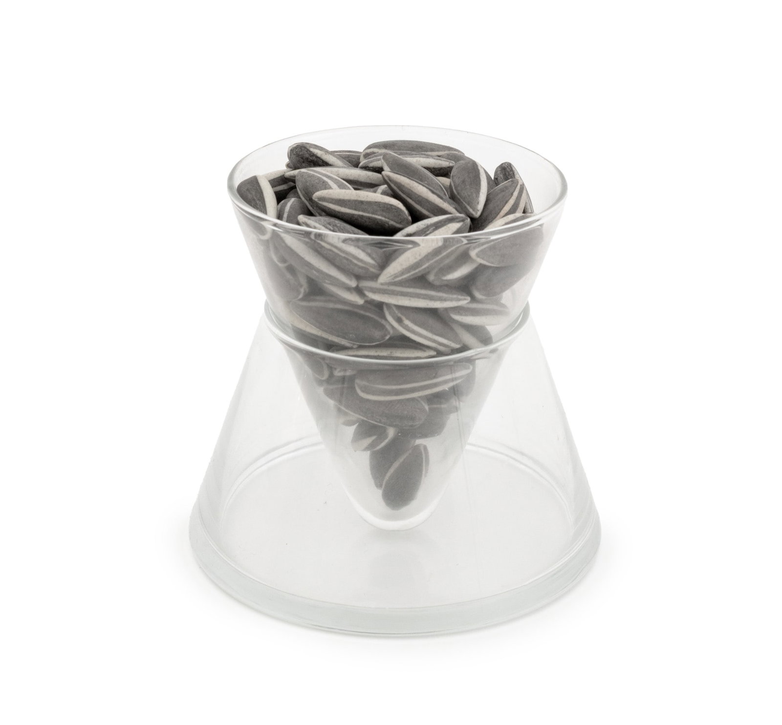 Ai Weiwei "Kui Hua Zi" Porcelain Sunflower Seeds: Ai Wei Wei (Chinese, b. 1957) "Kui Hua Zi" Trompe L'Oeil Porcelain Sunflower Seeds in a Two-Piece Glass Vase. Overall: 3.5" H x 3.5" Diameter. Provenance: From a 35 Sutton Place Estate. Exhibitions: