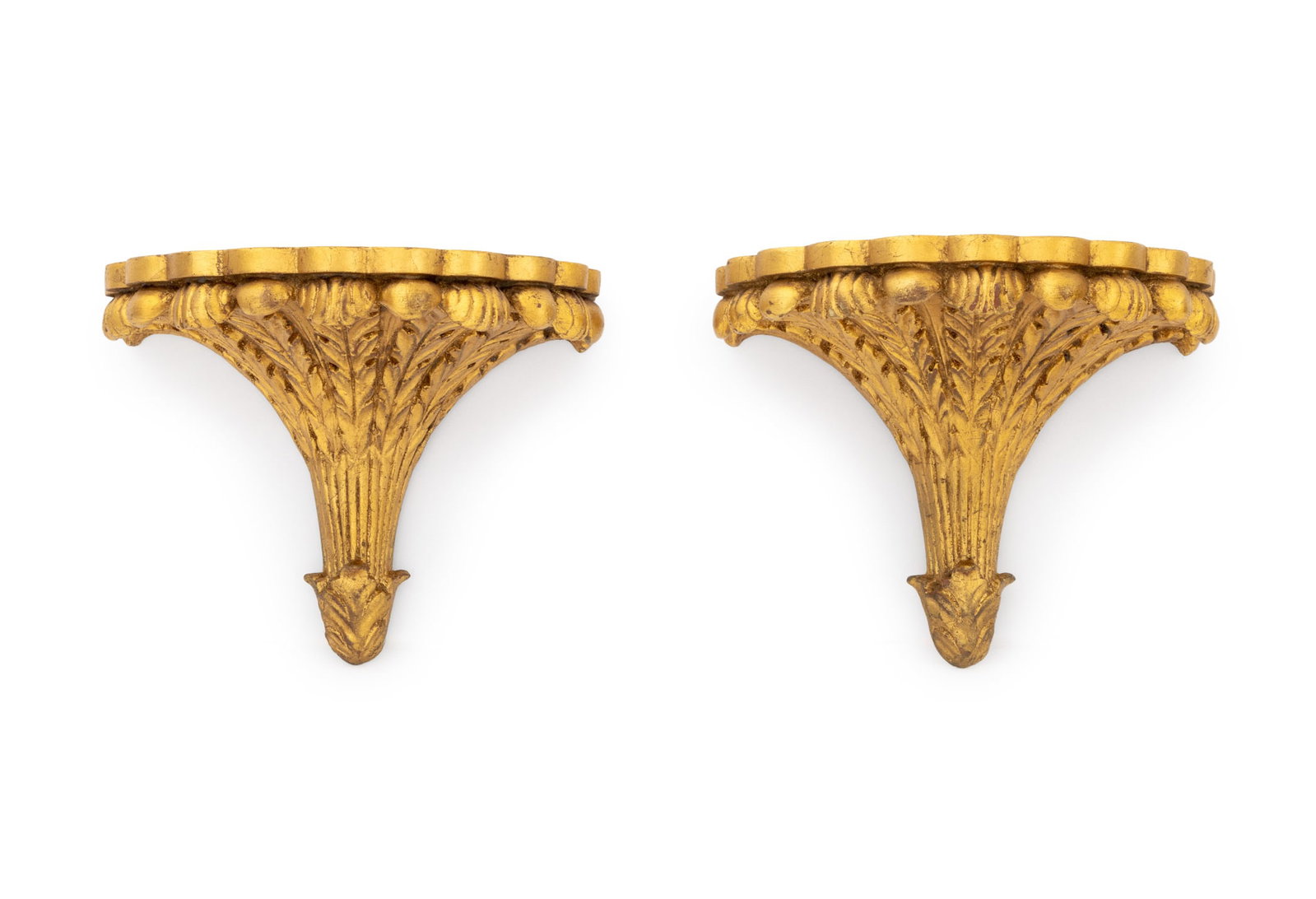Neoclassical Style Giltwood Wall Brackets, Pair: Pair of Neoclassical Style Giltwood Wall Brackets, each with acanthus leaf base surmounted by fluted stem and flaring foliate design. 8" H x 9.5" W x 6" D. Provenance: An East 75th Street Collection.