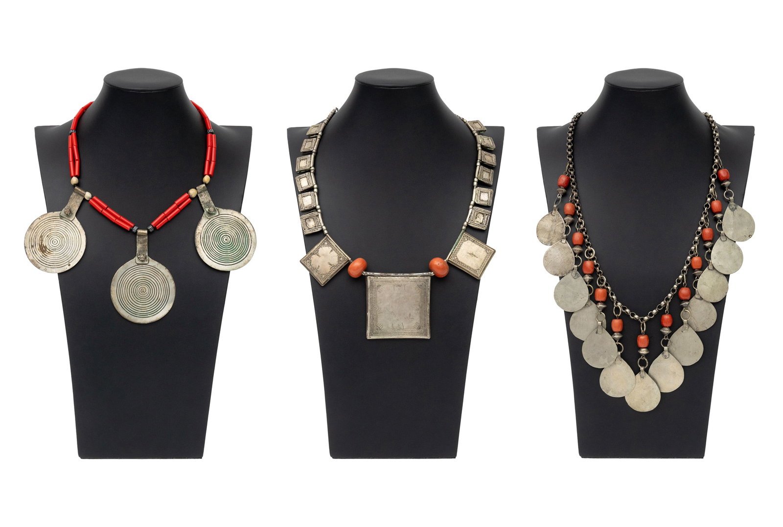 Irena Corwin Metalwork, Coral, Glass Necklaces, 3: Irena Corwin (American, XX) Collection of Three African Metalwork Necklaces, two with red coral beads and one with glass beads, one with Niger Tuareg pendant and one with Moroccan Berber pendants.