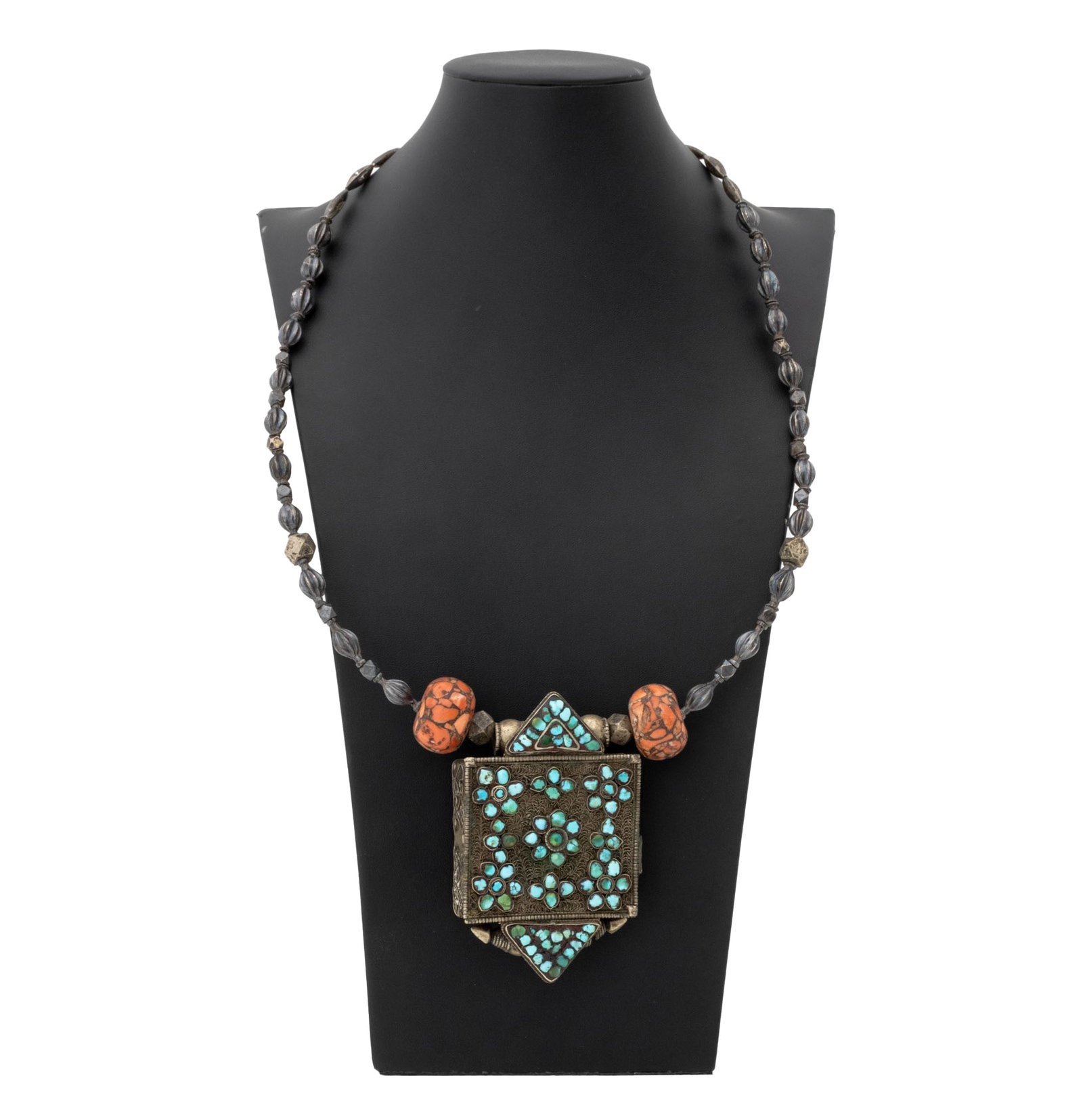 Irena Corwin Tibetan Ghau Box Pendant Necklace: Irena Corwin (American, XX) Tibetan Ghau Box Pendant Necklace, worn as a slip over the head necklace, the ghau prayer box mounted with turquoise cabochons, the chain with silver melon beads and red co