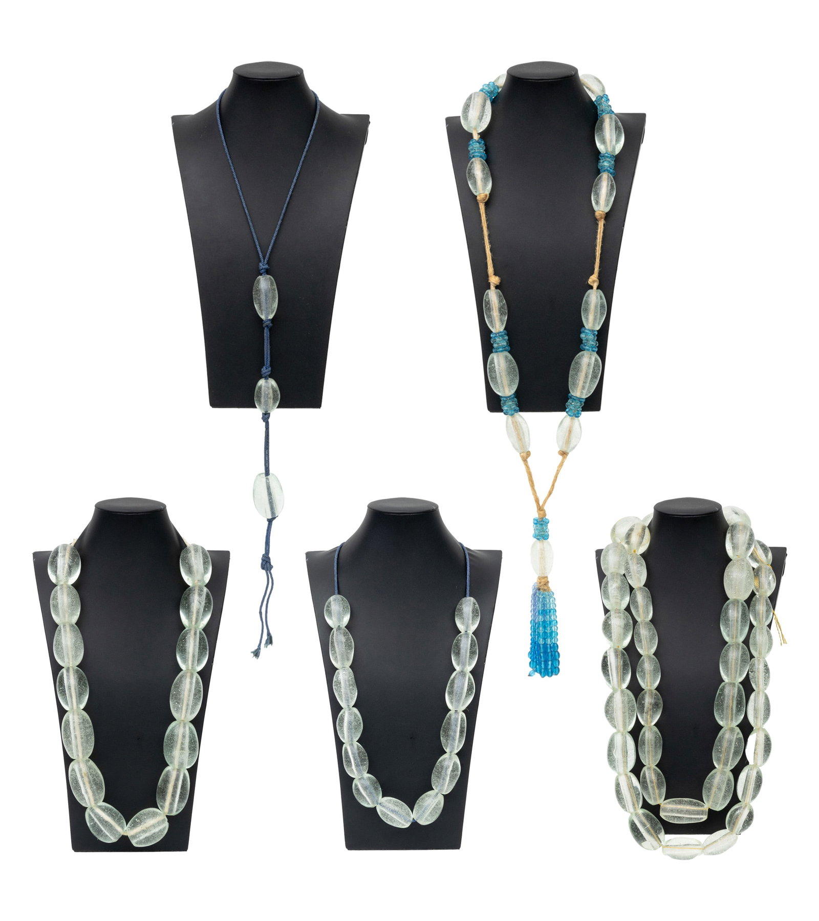 Collection of Encased Bubble Glass Bead Strands: Collection of Encased Bubble Blown Glass Bead Strands, together with faceted beads in aquamarine blue. Largest bead: 2.25" L x 1.5: Diameter. Provenance: From the Estate of Jewelry Designer Irena Corw