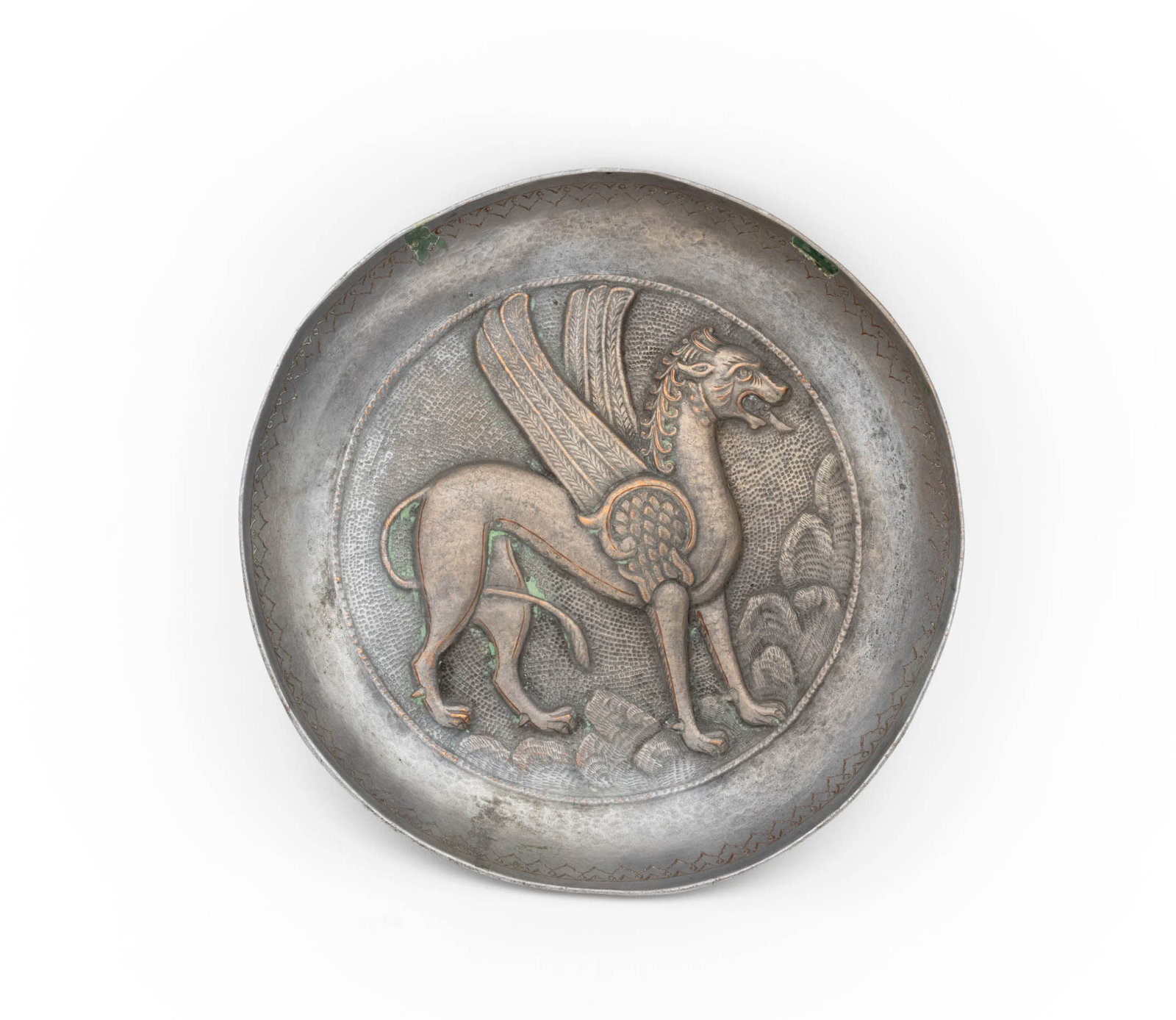 Persian Griffin Motif Silvered Copper Charger: Persian Griffin Motif Silvered Copper Charger, in the Sogdia manner, repousse decorated with incised and hammered details. 9.25" Diameter x 1.5" D. Provenance: From an Upper West Side Estate. Keywords