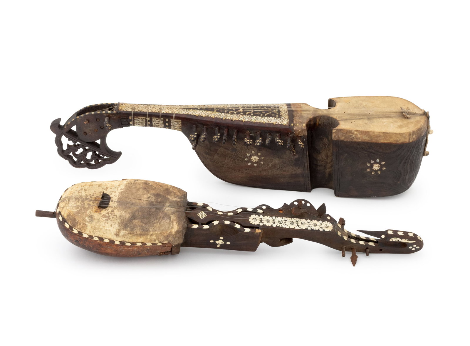Afghan Bone & Mother-of-Pearl Inlaid Rubabs, 2: Group of Two Afghan Bone and Mother -of-Pearl Inlaid Rubabs, carved wood and goat skin, one with pierced pegboard and other with bird-form neck. Larger: 33.5" L x 6.25" W x 8" D. Provenance: From an U