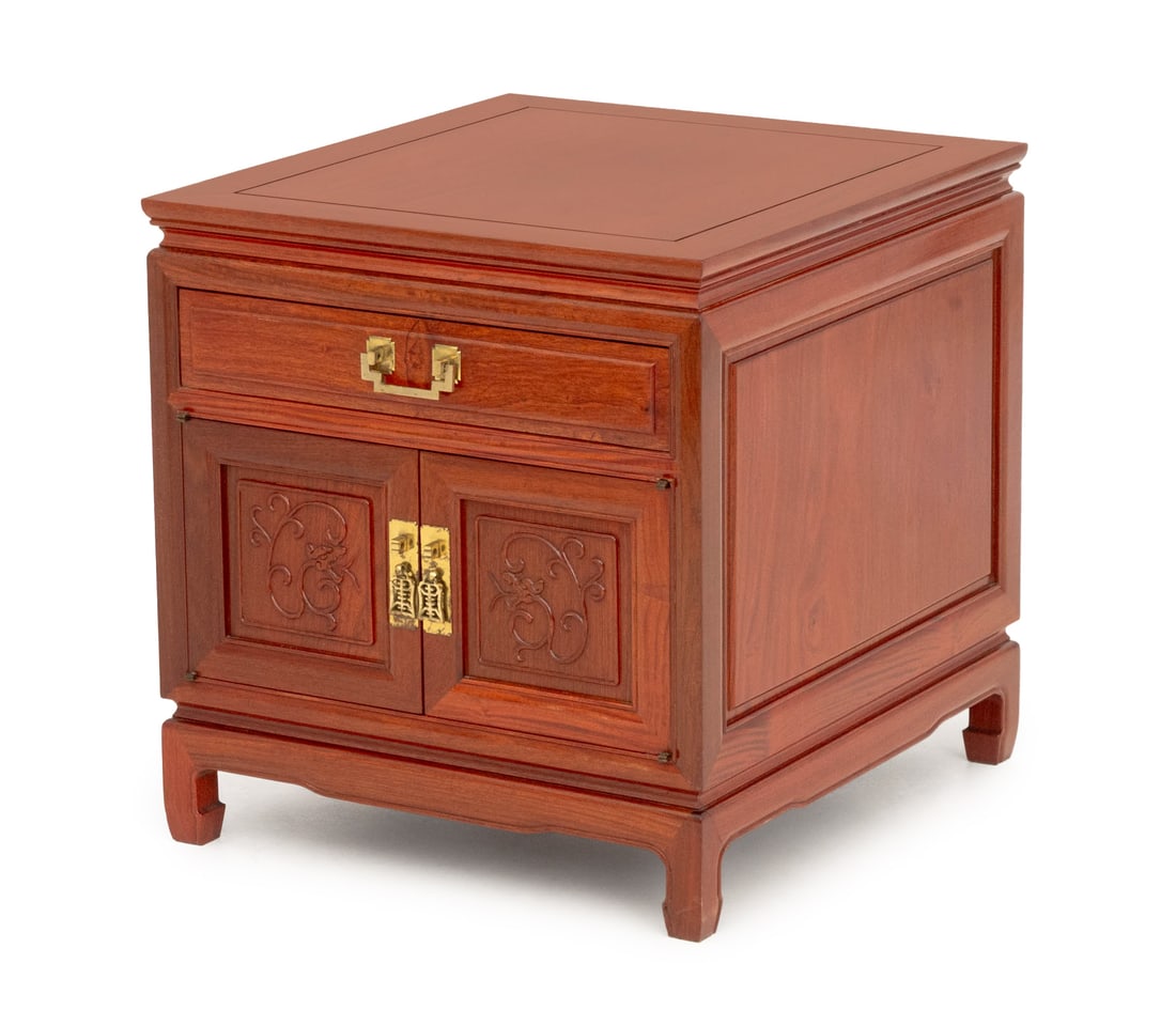 George Zee & Co. Attr. Rosewood Nightstand: George Zee and Co. Attributed Rosewood Nightstand, with single drawer above two-door cabinet with carved cherry blossom motif and brass hardware. 23.25" H x 22" W x 24" D. Provenance: From a New York 