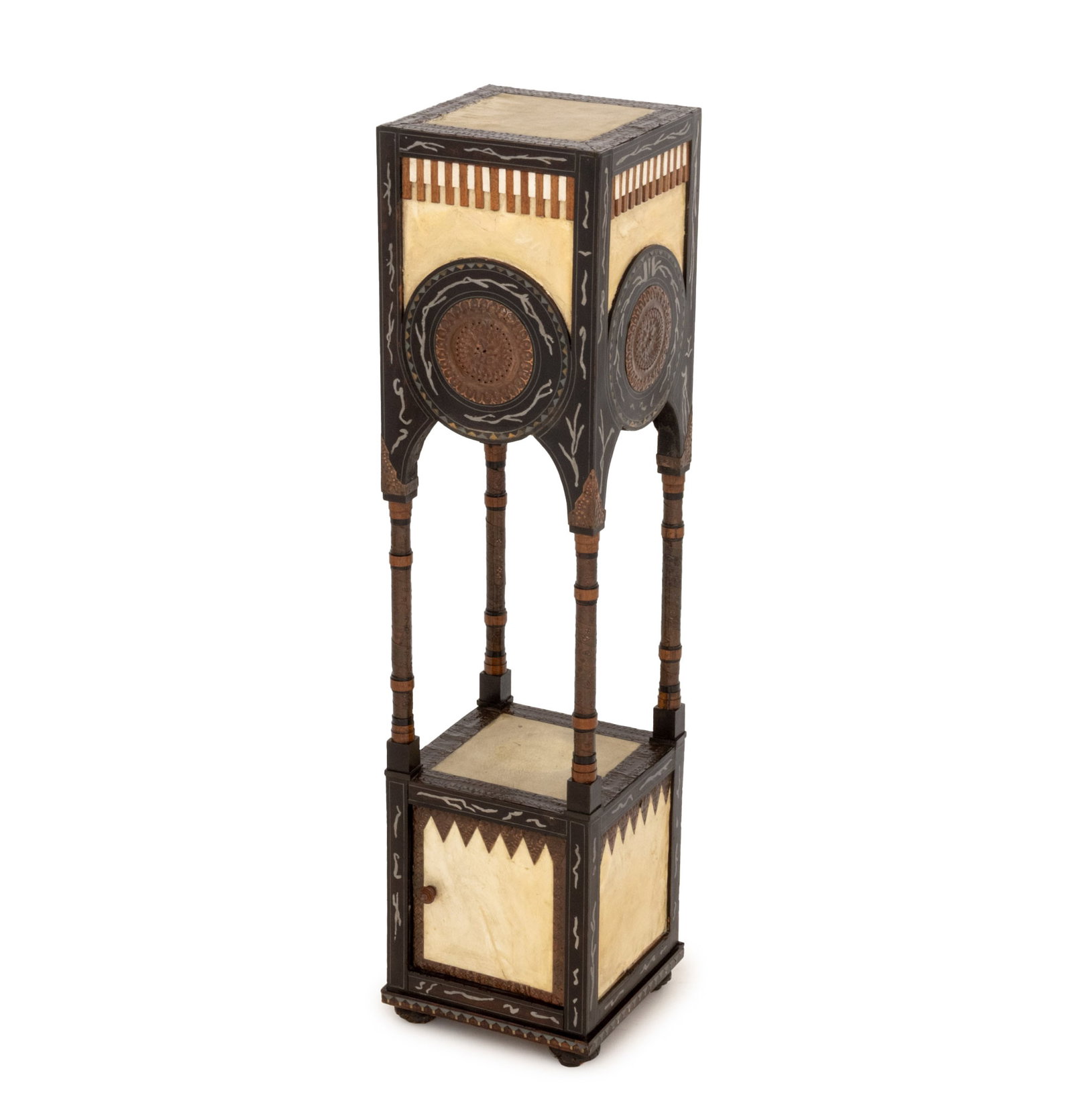 Carlo Bugatti Pedestal Cabinet: Carlo Bugatti (Italian, 1855-1940) Pedestal Cabinet, ebonized and lacquered walnut wood with copper and pewter inlay, parchment. 49" H x 12.5" W x 12.5" D. Provenance: From a Sutton Place Collection. 