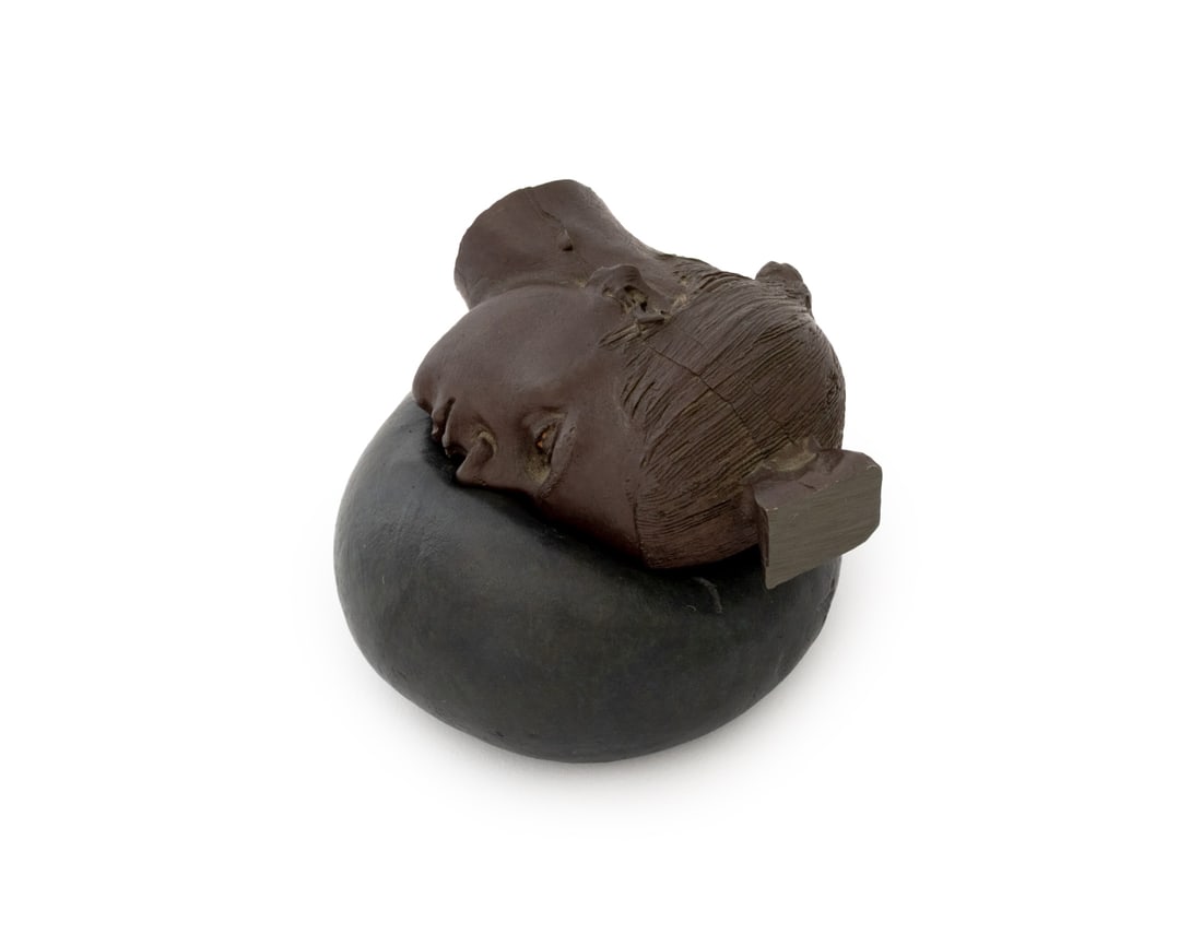 Robert Graham Untitled Bronze Sculpture, 2002: Robert Graham (Mexican/American, 1938-2008) Untitled (Woman's Head on Pillow) Patinated Bronze Sculpture, 2002, in two parts, the base signed "R. Graham" to underside. Overall: 2" H x 3" W x 3.5" D. P
