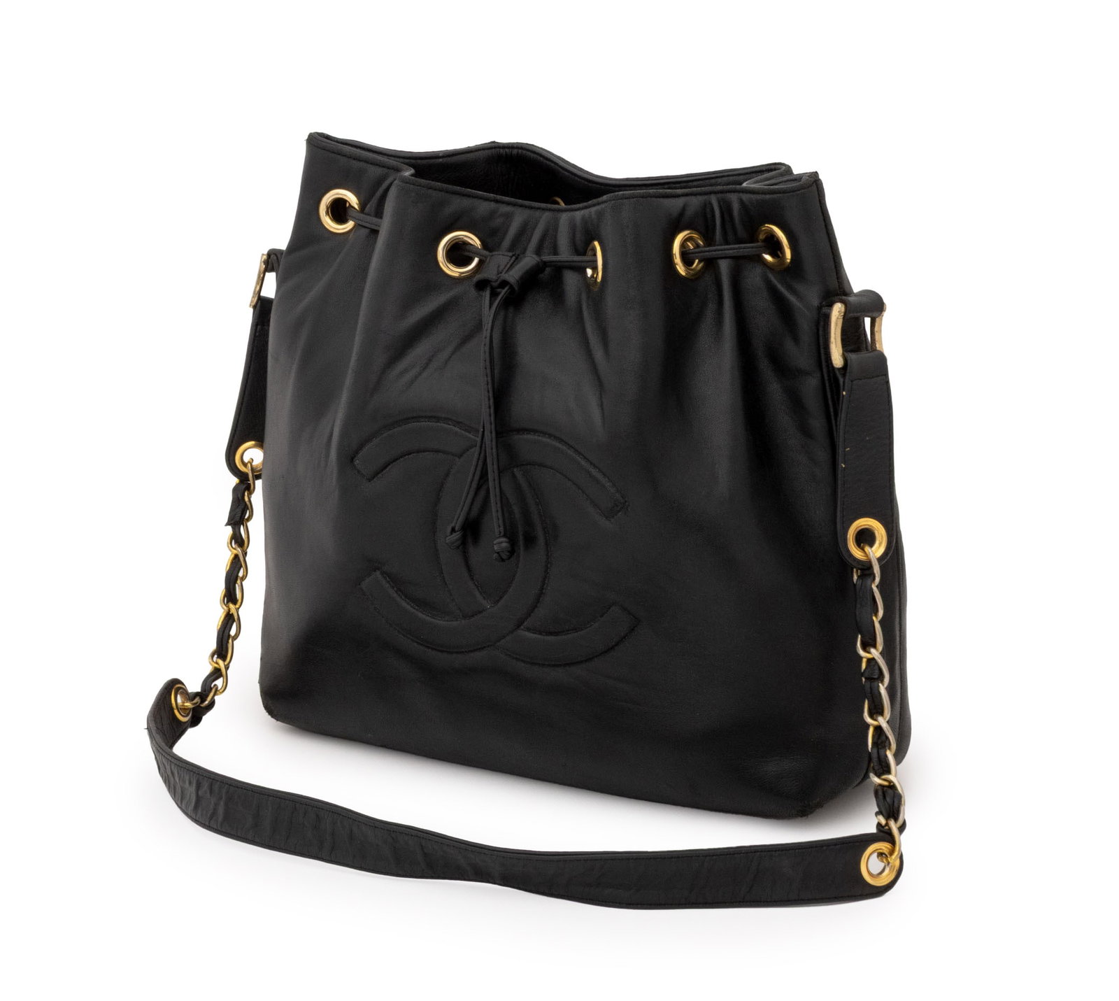 Chanel Black Lambskin Leather Bucket Shoulder Bag: Chanel Black Lambskin Leather Bucket Shoulder Bag, the front face with quilted CC logo, the strap with gold-tone hardware, marked "Chanel" inside. Without strap: 11.5" H x 15" W x 4.5" D. Provenance: