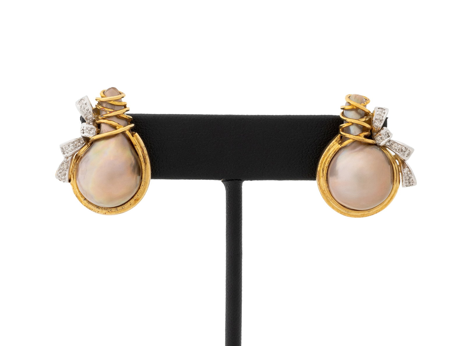 Two-Tone Gold, Diamond, and Pearl Earrings: Pair of 14K Rose Gold, White Gold, Diamond, and Pearl Earrings, featuring twenty two pave set round brilliant cut diamonds weighing a total of approx. 0.25 carat, decorated with two cultured baroque d
